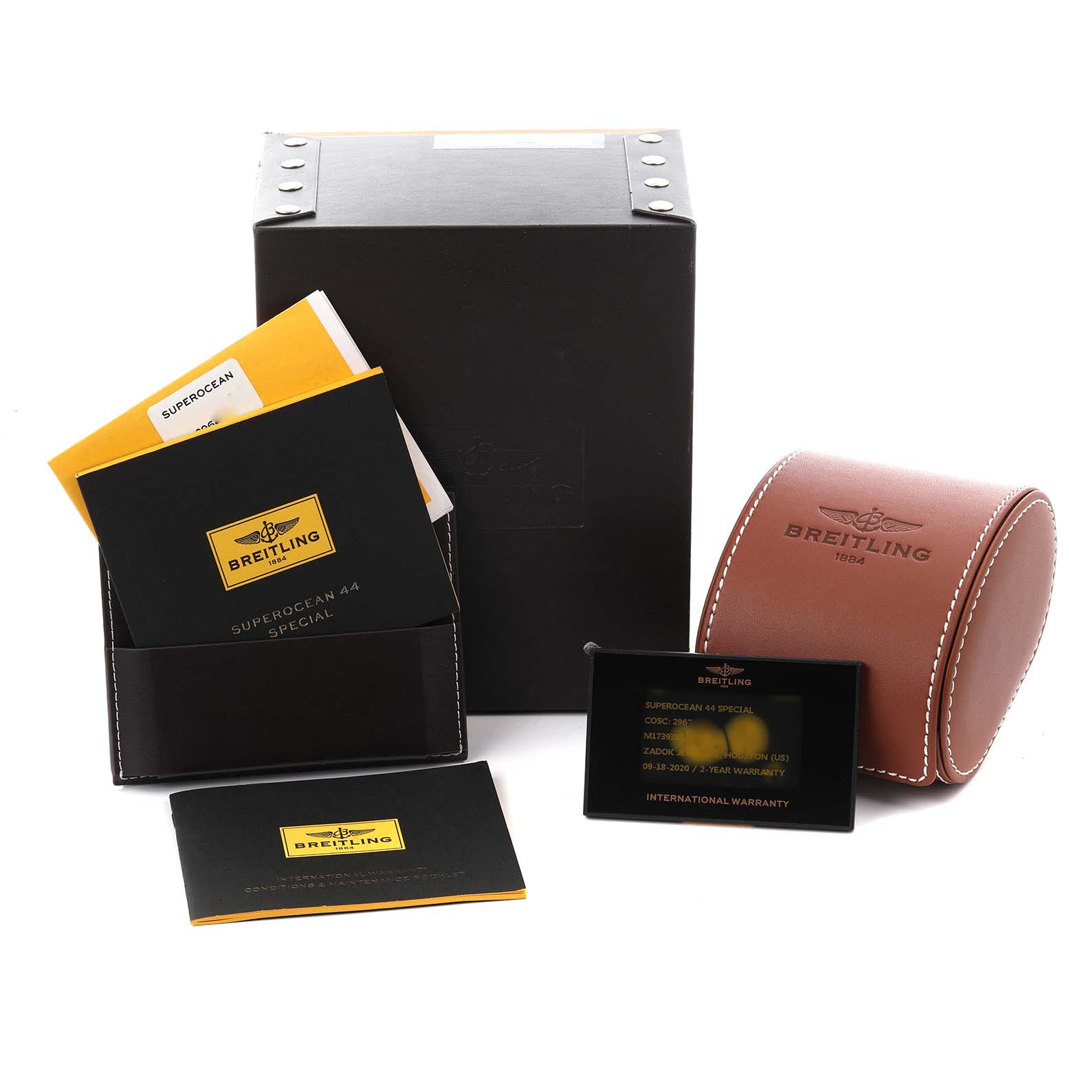 The image shows Breitling Superocean M17393 Men's Stainless Steel Black Dial M17393 Men's Stainless Steel Black Dial accessories, including a box, case, manuals, and warranty card.