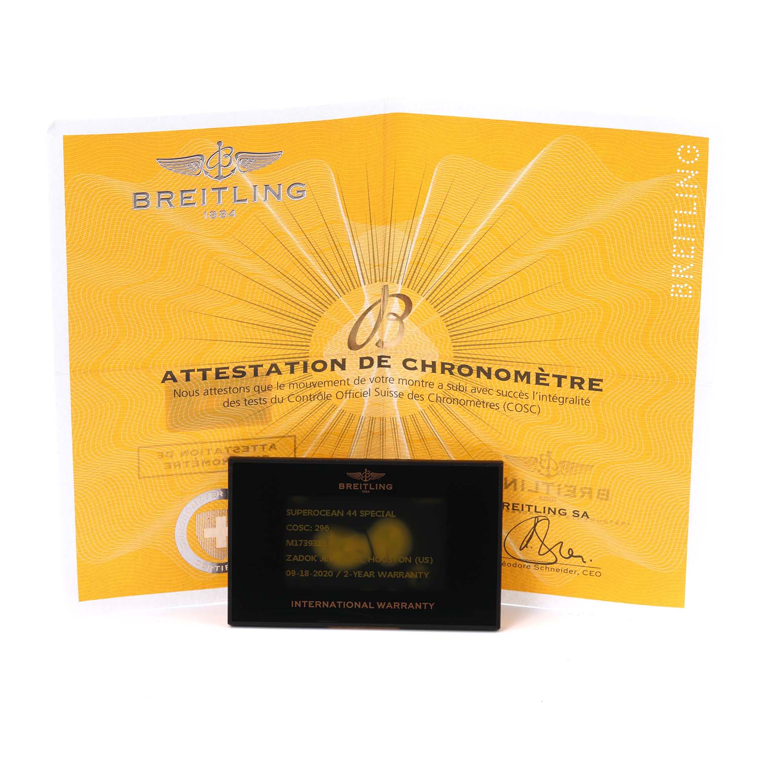 The image shows the Breitling Superocean M17393 Men's Stainless Steel Black Dial M17393 Men's Stainless Steel Black Dial warranty card and chronometer certificate.