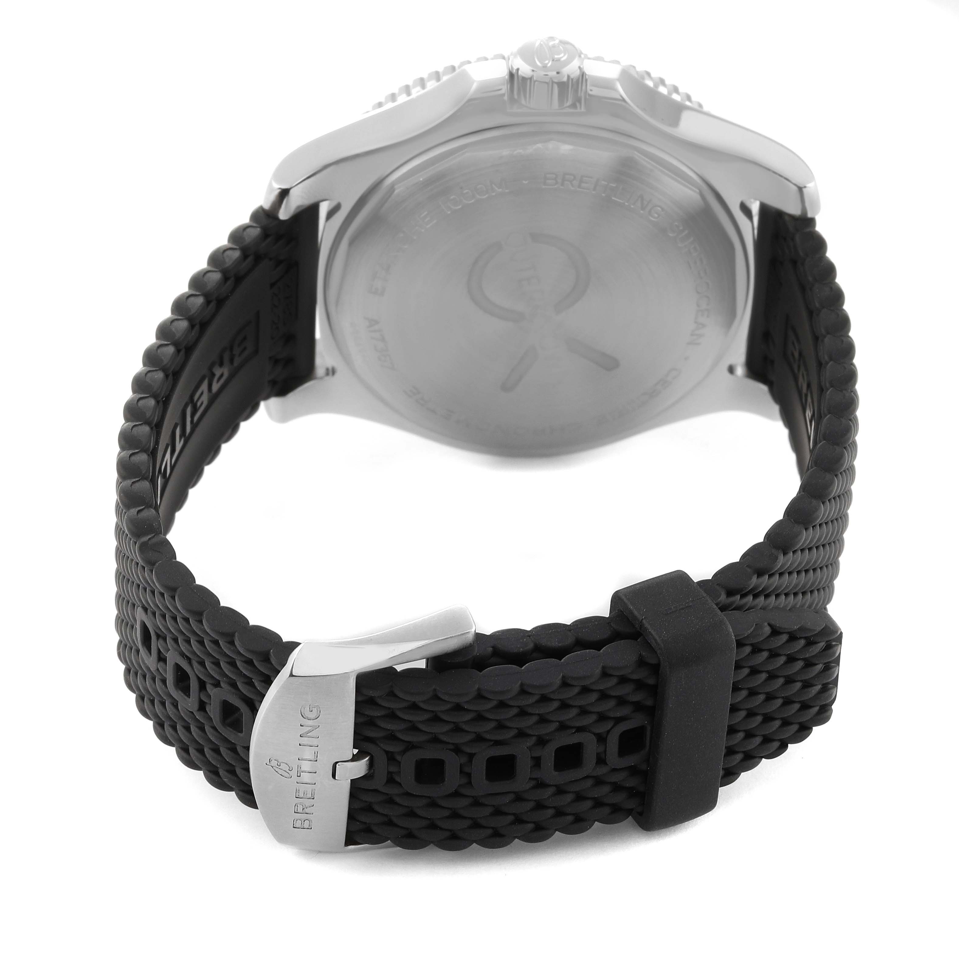 The image shows the rear angle of a Breitling Superocean A17367 Men's Stainless Steel Green Dial A17367 Men's Stainless Steel Green Dial watch, focusing on the case back and black rubber strap with the brand logo on the clasp.