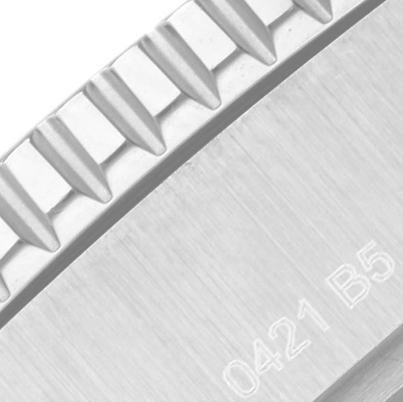 The image shows a close-up of the bezel and engraved case back of a Breitling Superocean A17367 Men's Stainless Steel Green Dial A17367 Men's Stainless Steel Green Dial model watch.