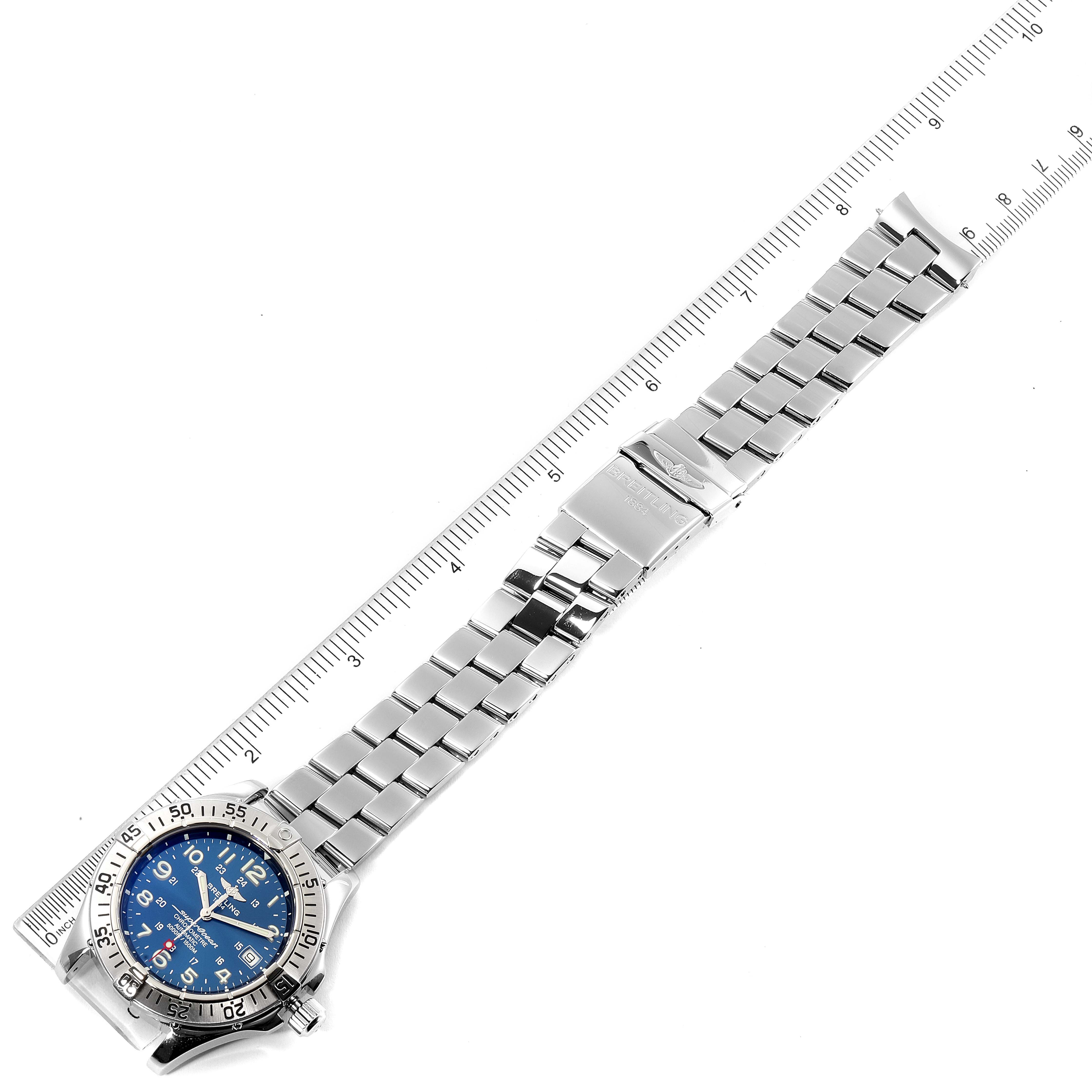 The image shows a Breitling Superocean A17360 Men's Stainless Steel Blue Dial A17360 Men's Stainless Steel Blue Dial watch laid flat with a metal bracelet and a ruler measuring its length.