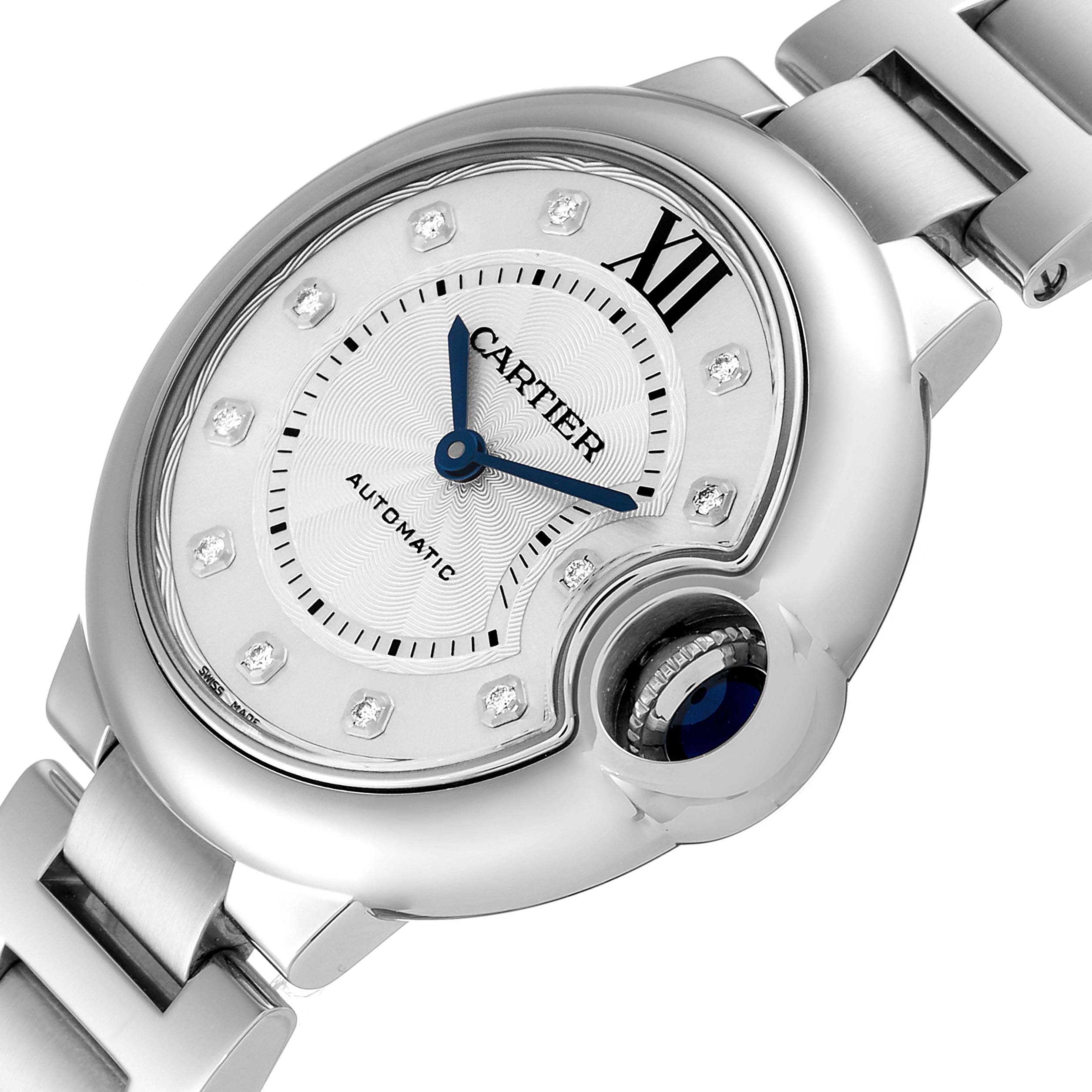 The image shows a close-up of the Ballon Bleu de Cartier watch face and part of the metal bracelet.