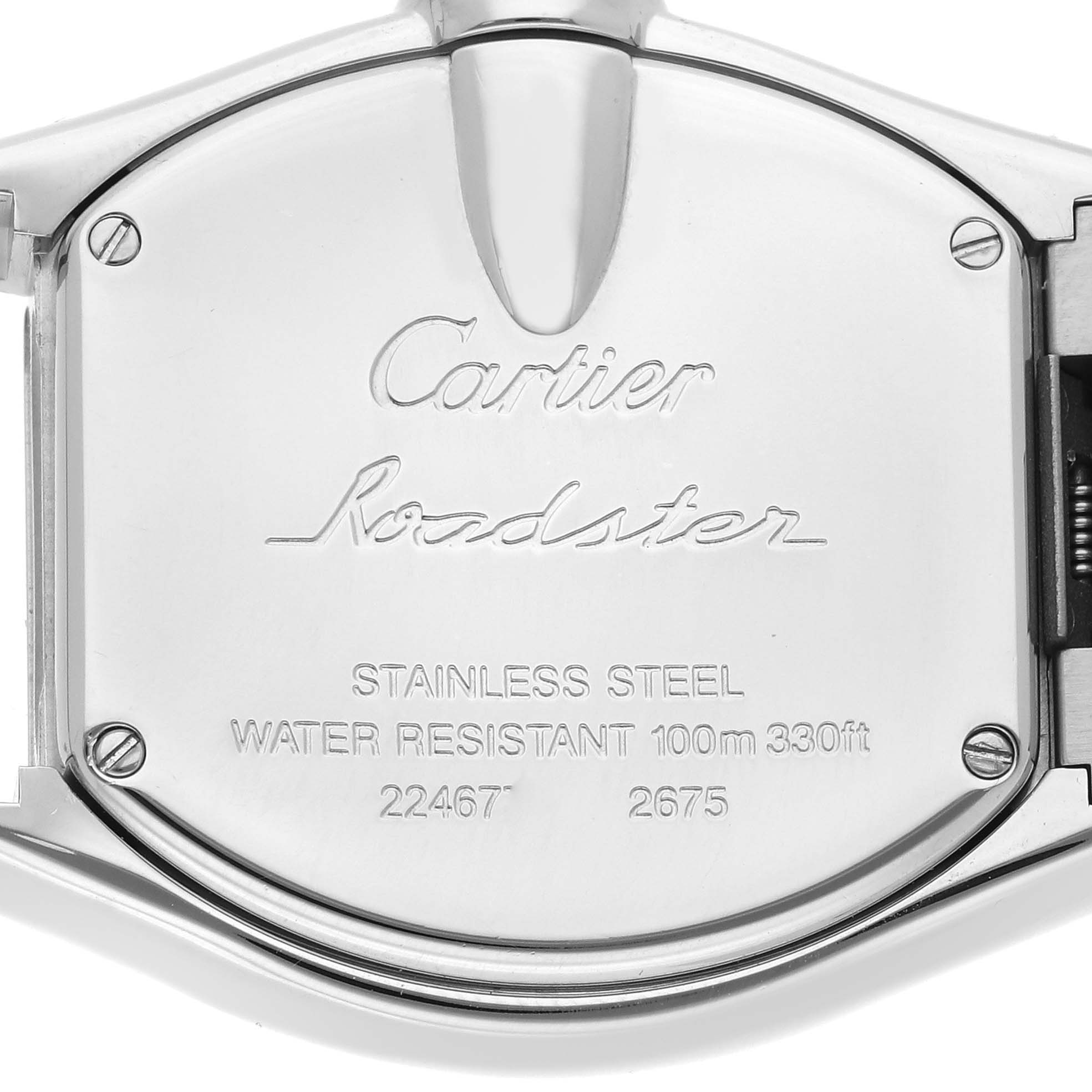 The image shows the back case of a Cartier Roadster W62016V3 Women
s Stainless Steel Silver Dial W62016V3 Women
s Stainless Steel Silver Dial watch, highlighting the engraved details.