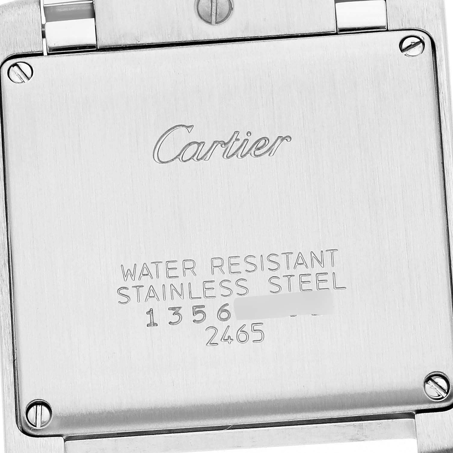 The image shows the back case of a Cartier Tank Française watch, highlighting the brand and material details.