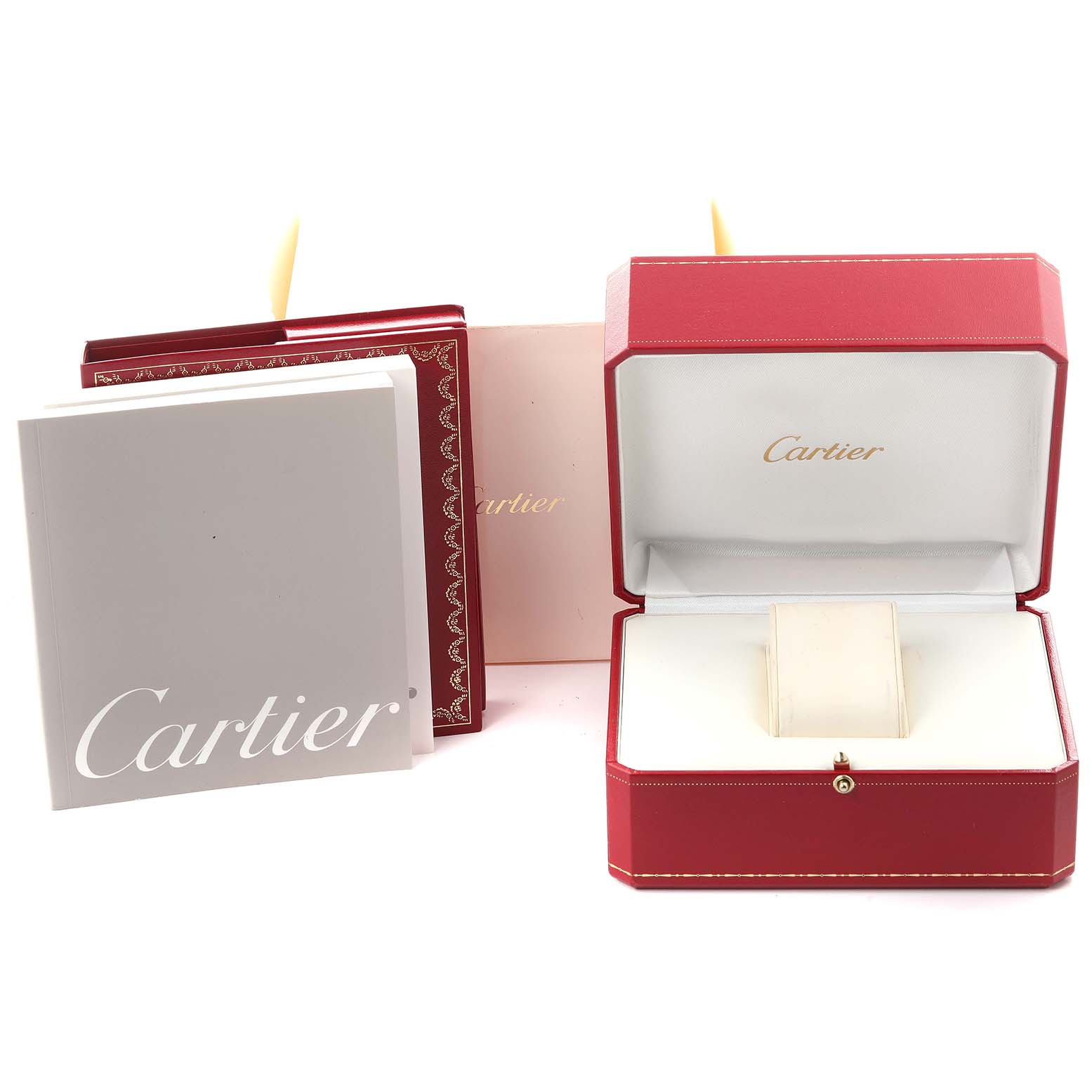 The image shows an open Cartier watch box for the Tank Française model with packaging and a booklet.