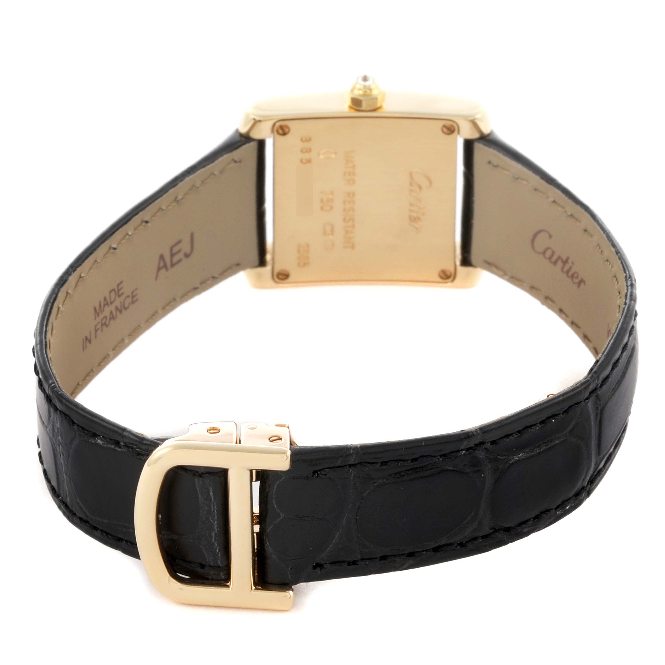 The Cartier Tank Française watch is shown from the back, highlighting the clasp, strap, and caseback details.