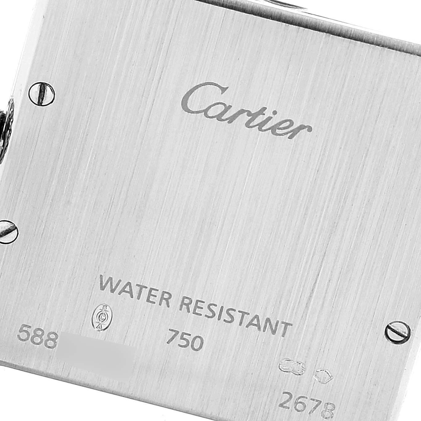 The image shows the back case of a Tank Louis Cartier watch, displaying inscriptions and markings.