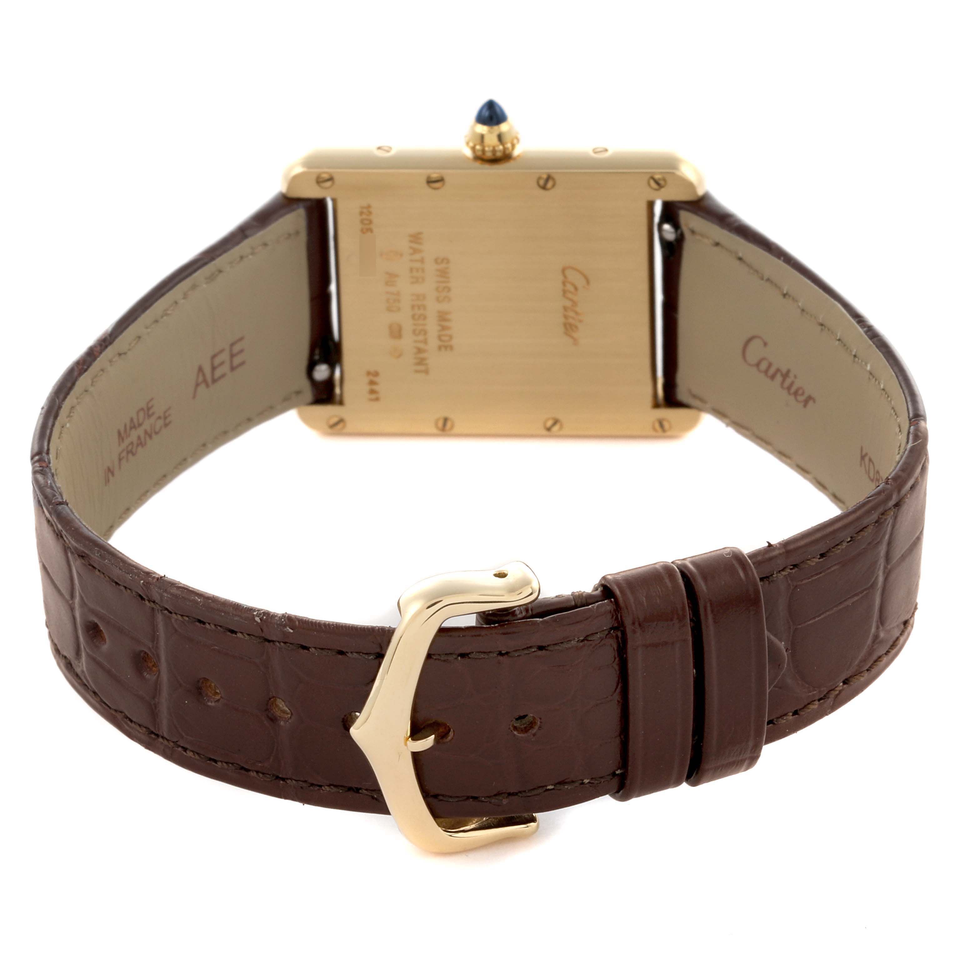 The image shows the back and strap of a Cartier Tank Louis W1529756 Men's Yellow Gold Silver Dial W1529756 Men's Yellow Gold Silver Dial watch, highlighting the clasp and backplate with inscriptions.