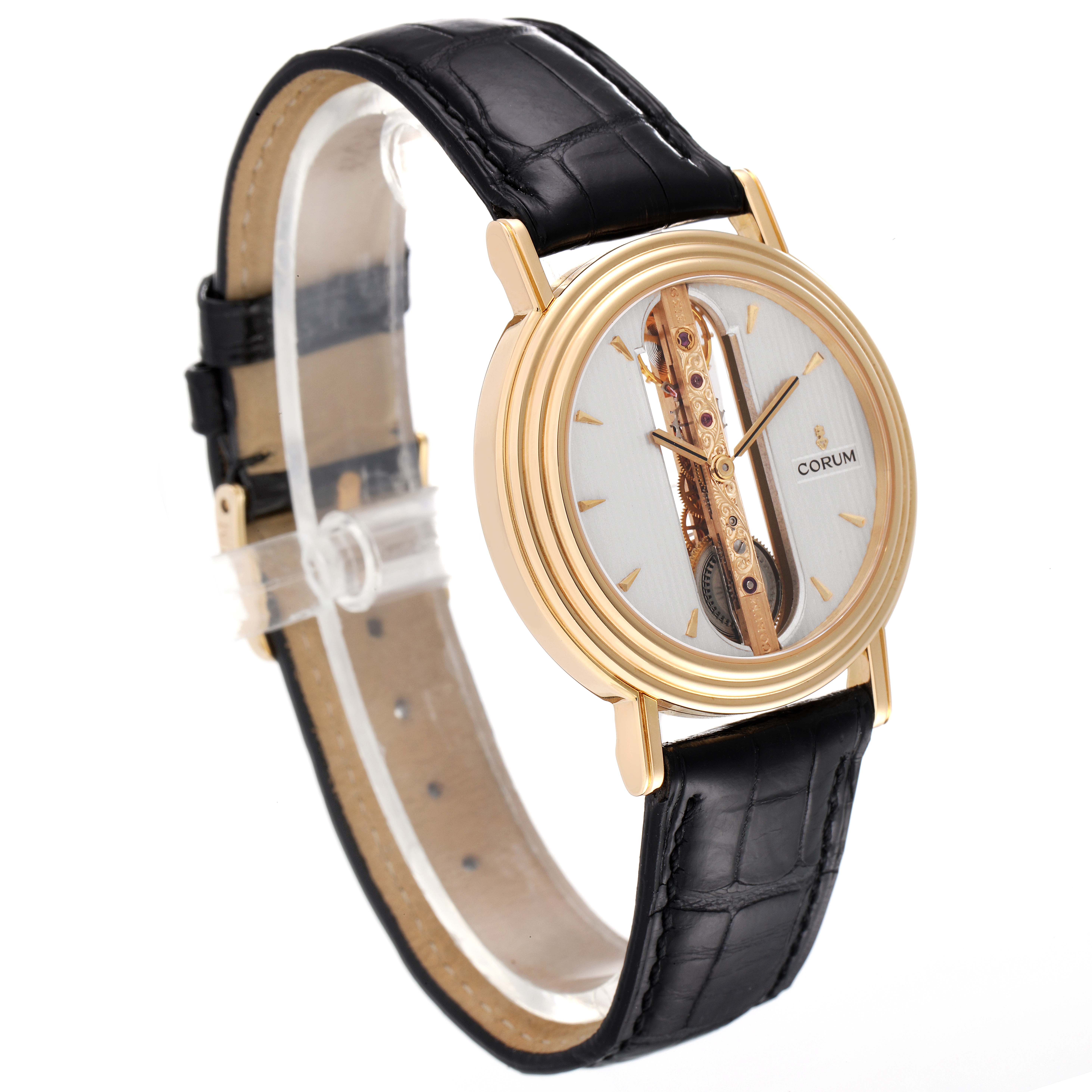 The image shows a side angle of the Corum Golden Bridge 13.240.58 Men's Yellow Gold Silver Dial 13.240.58 Men's Yellow Gold Silver Dial watch, highlighting its unique linear movement and black leather strap.