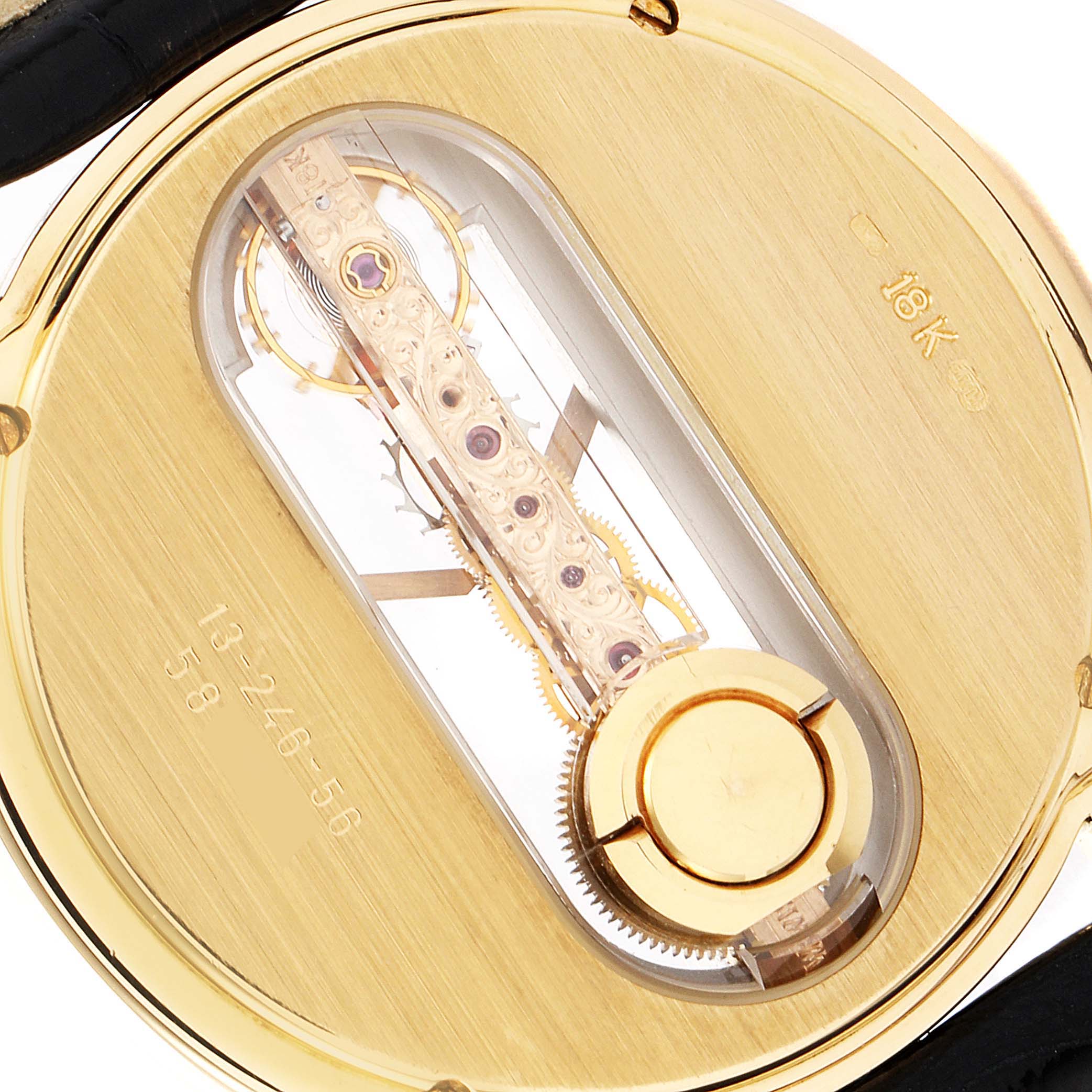 The image shows the back view of a Corum Golden Bridge 13.240.58 Men's Yellow Gold Silver Dial 13.240.58 Men's Yellow Gold Silver Dial watch, highlighting its intricate mechanical movement and 18K gold casing.