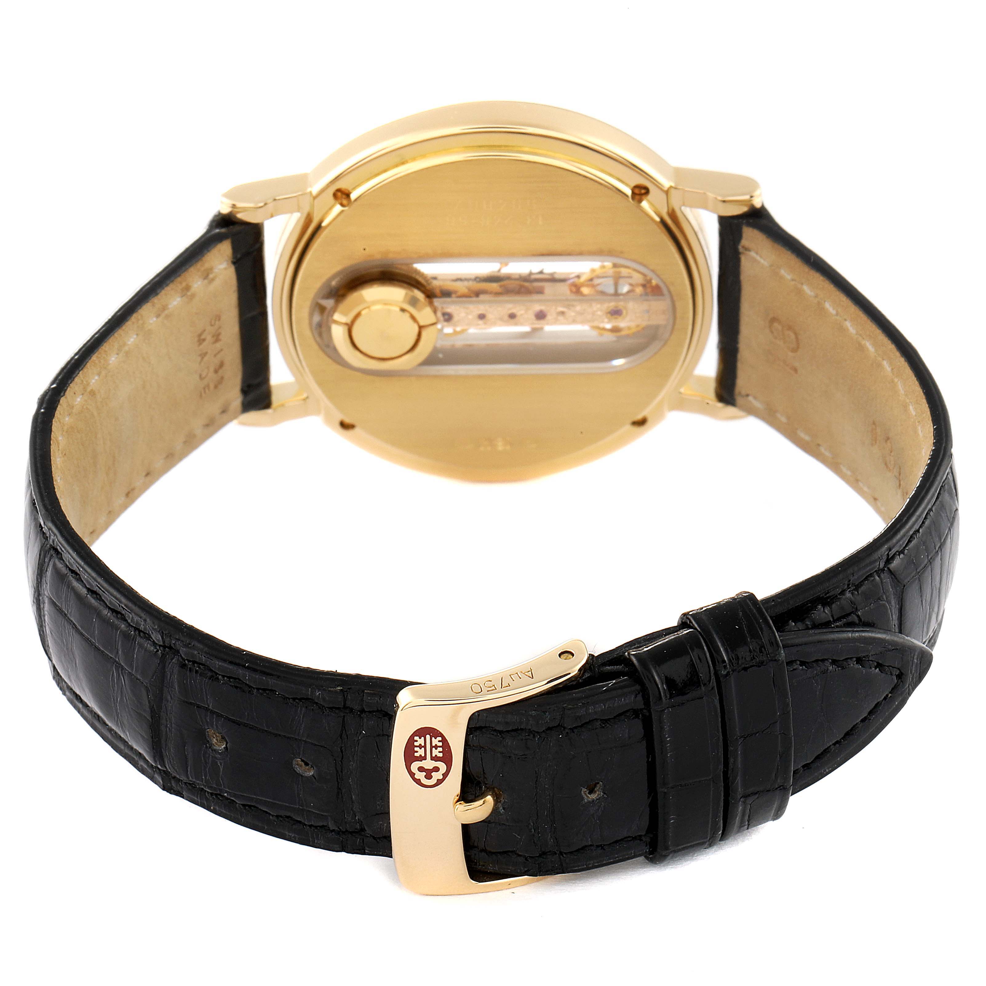 The image shows the back side of the Corum Golden Bridge 13.240.58 Men's Yellow Gold Silver Dial 13.240.58 Men's Yellow Gold Silver Dial model watch, highlighting the gold case and black leather strap.