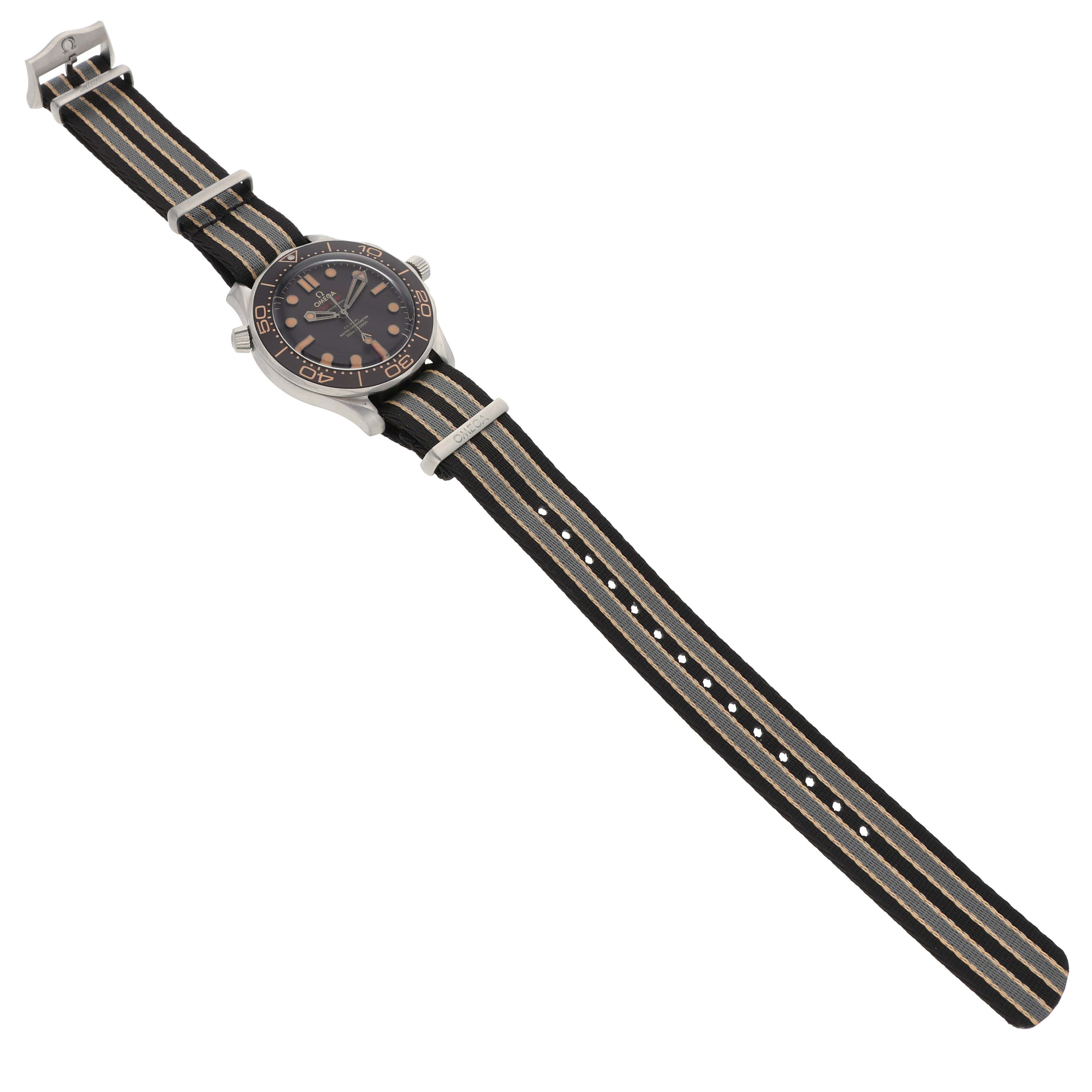 The Omega Seamaster 210.92.42.20.01.001 Men's Titanium Brown Dial 210.92.42.20.01.001 Men's Titanium Brown Dial watch is shown at an angled view featuring its face and full striped NATO strap.