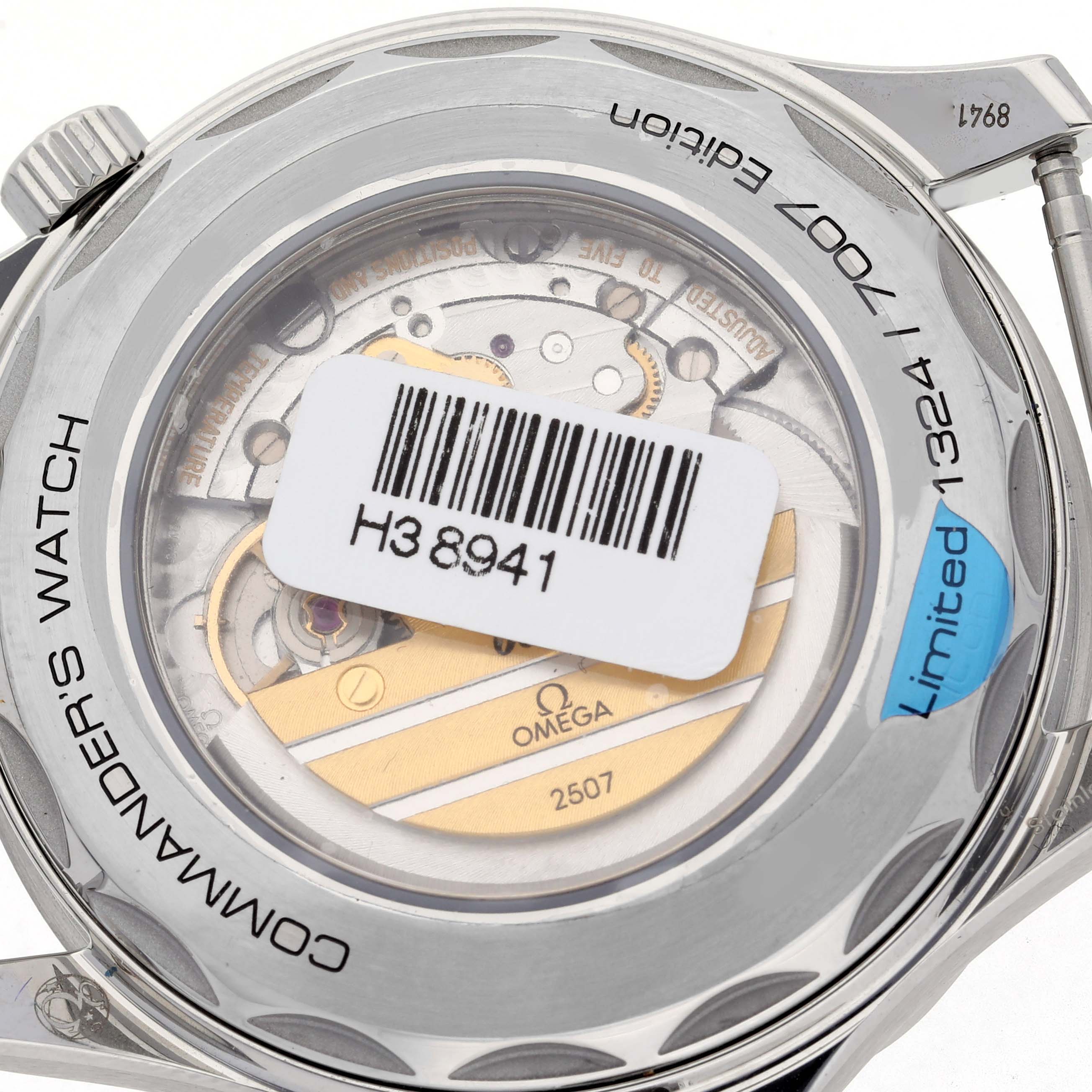 The image shows the back view of an Omega Seamaster 212.32.41.20.04.001 Men's Stainless Steel White Dial 212.32.41.20.04.001 Men's Stainless Steel White Dial, highlighting the movement and limited edition engraving.