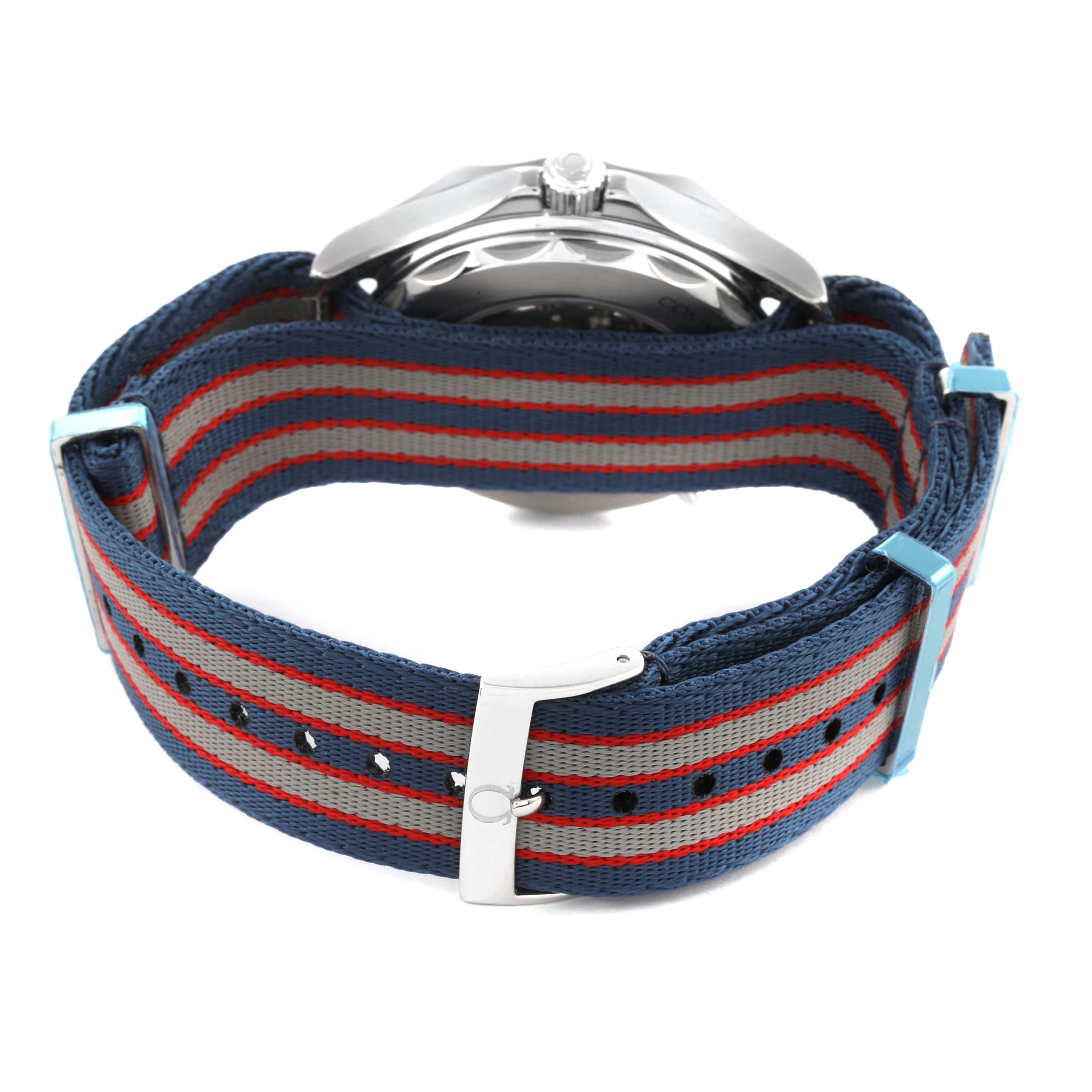 The Omega Seamaster 212.32.41.20.04.001 Men's Stainless Steel White Dial 212.32.41.20.04.001 Men's Stainless Steel White Dial is shown from the back, highlighting its striped NATO strap and partial watch casing.