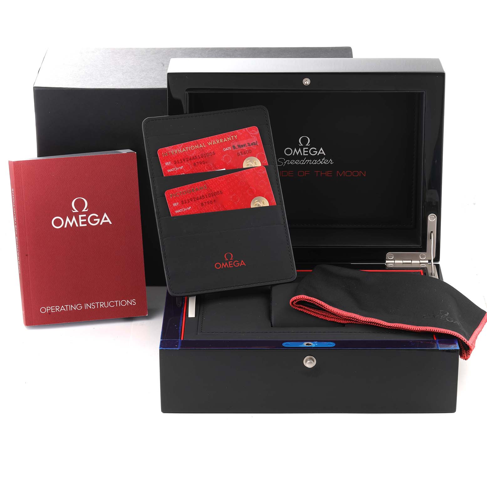 The image shows the packaging, accessories, instruction manual, warranty cards, and cloth for the Omega Speedmaster 311.92.44.51.01.005 Men's Ceramic Black Dial 311.92.44.51.01.005 Men's Ceramic Black Dial watch.