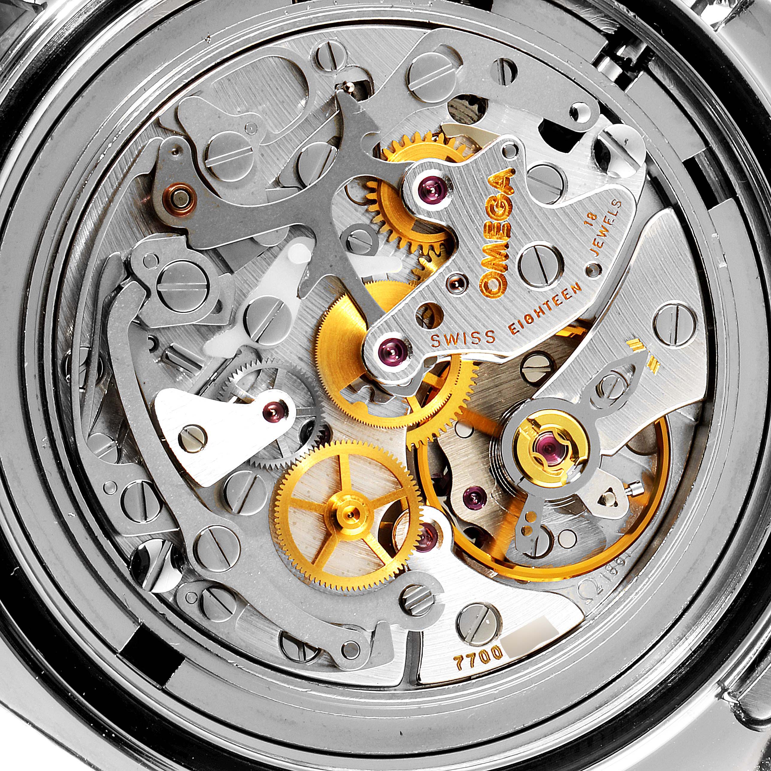 The image shows the intricate inner mechanisms of an Omega Speedmaster 3570.50.00 Men
s Stainless Steel Black Dial 3570.50.00 Men
s Stainless Steel Black Dial watch at a close-up angle.