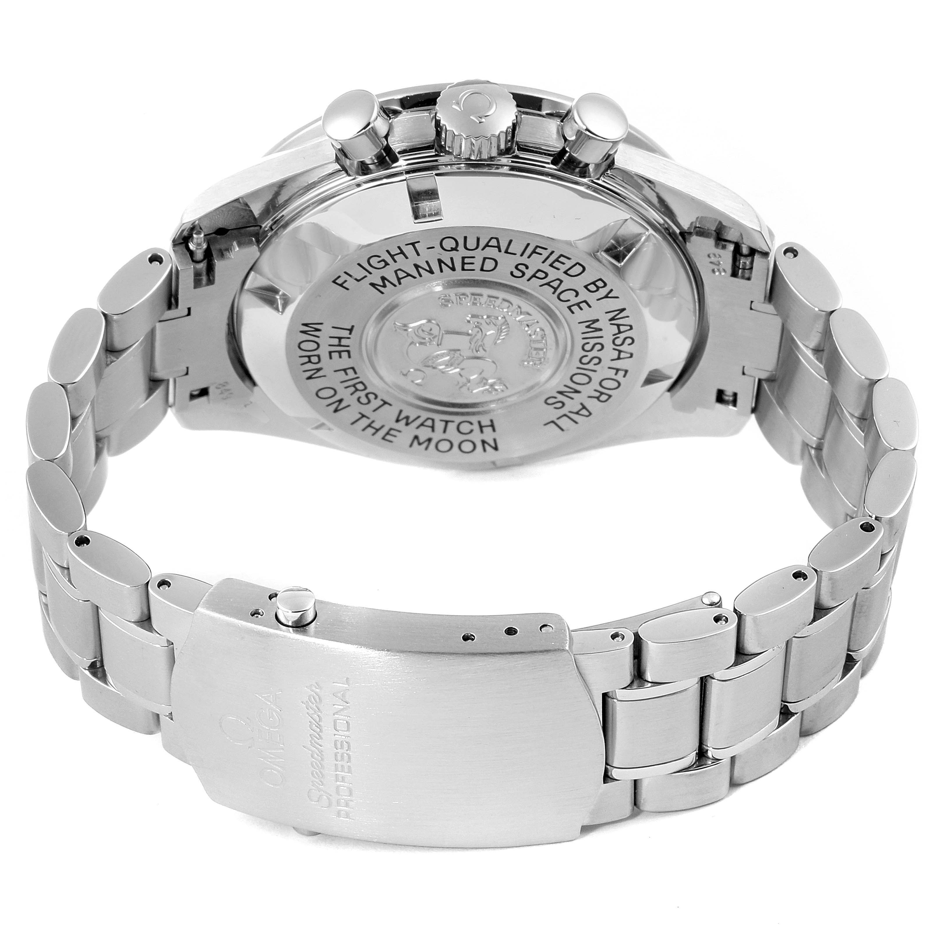 The image shows the back case and bracelet clasp of an Omega Speedmaster 3570.50.00 Men
s Stainless Steel Black Dial 3570.50.00 Men
s Stainless Steel Black Dial watch, highlighting engravings and the metal strap.