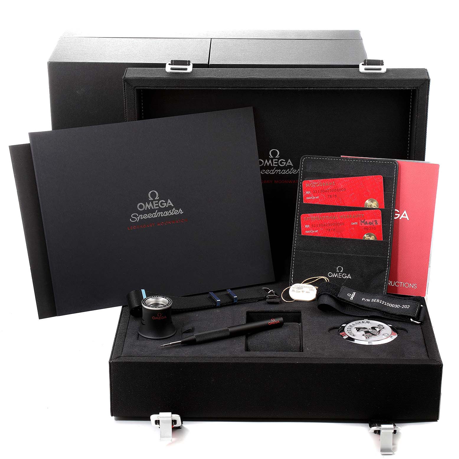 The image shows an Omega Speedmaster 311.30.42.30.01.005 Men
s Stainless Steel Black Dial 311.30.42.30.01.005 Men
s Stainless Steel Black Dial watch box set with papers, accessories, and a loupe, displayed from the front angle.