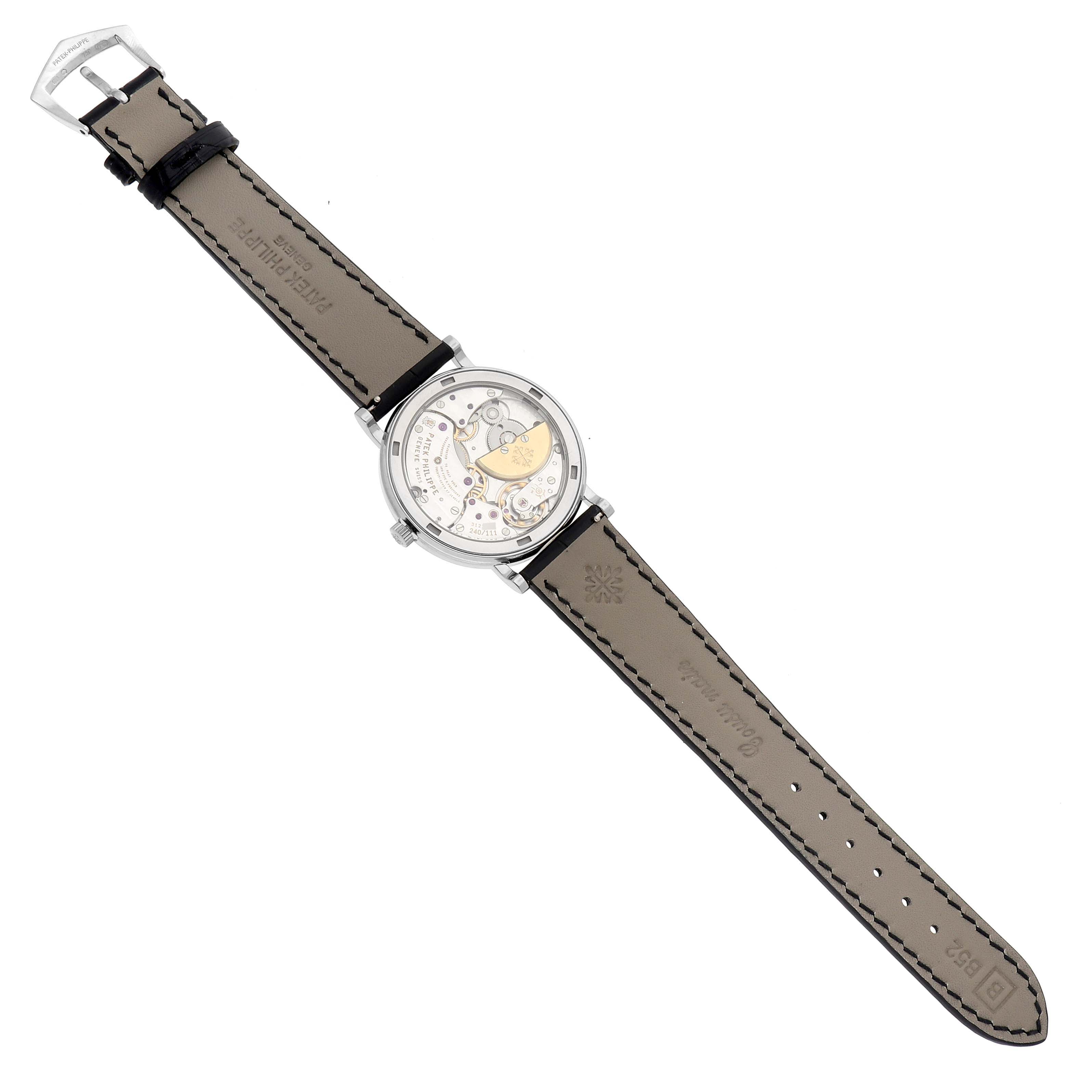 The Patek Philippe Calatrava 5120G Men's White Gold White Dial 5120G Men's White Gold White Dial watch is shown from the back, displaying the transparent case and strap details.