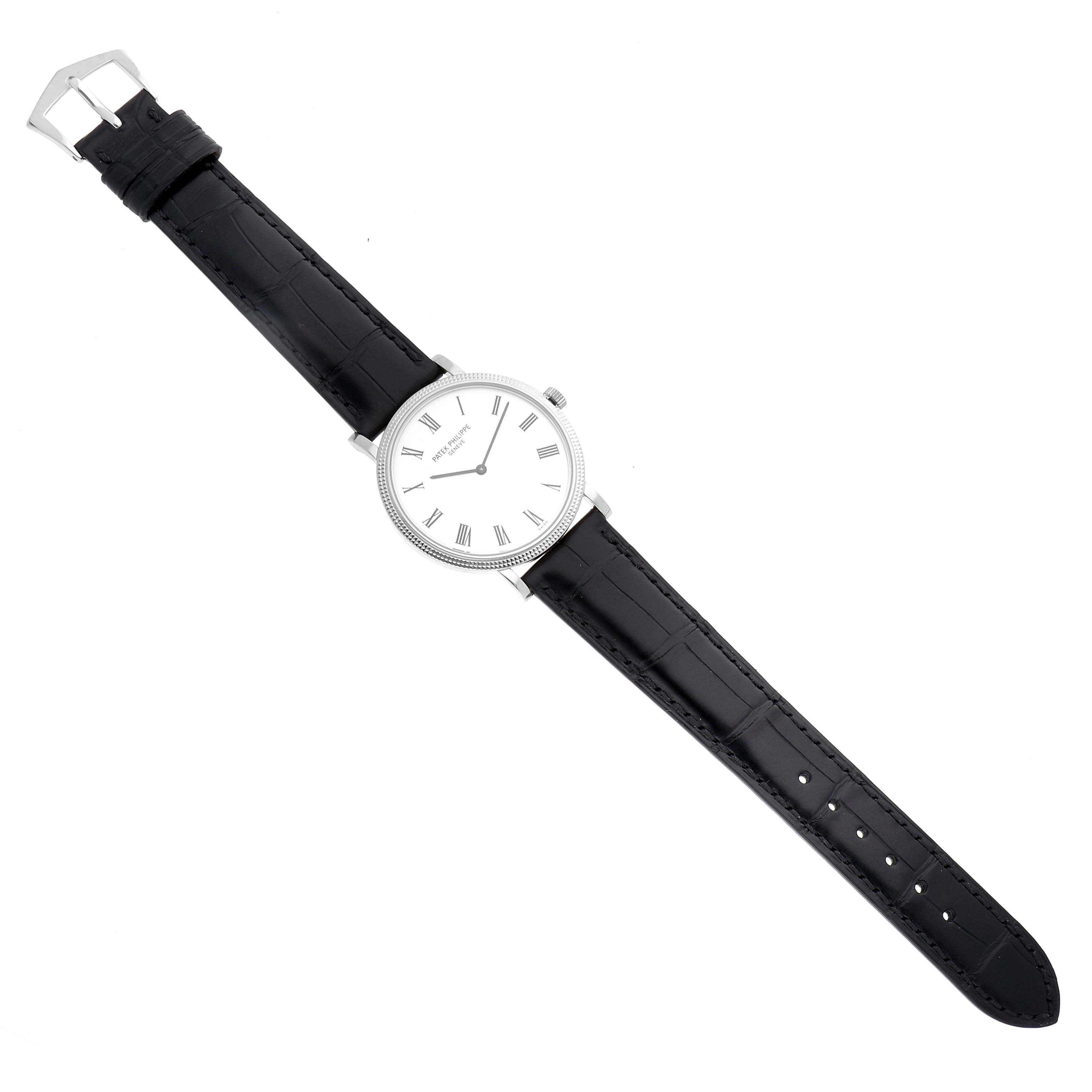 The Patek Philippe Calatrava 5120G Men's White Gold White Dial 5120G Men's White Gold White Dial watch is shown from a top view, highlighting the white dial, leather strap, and buckle.