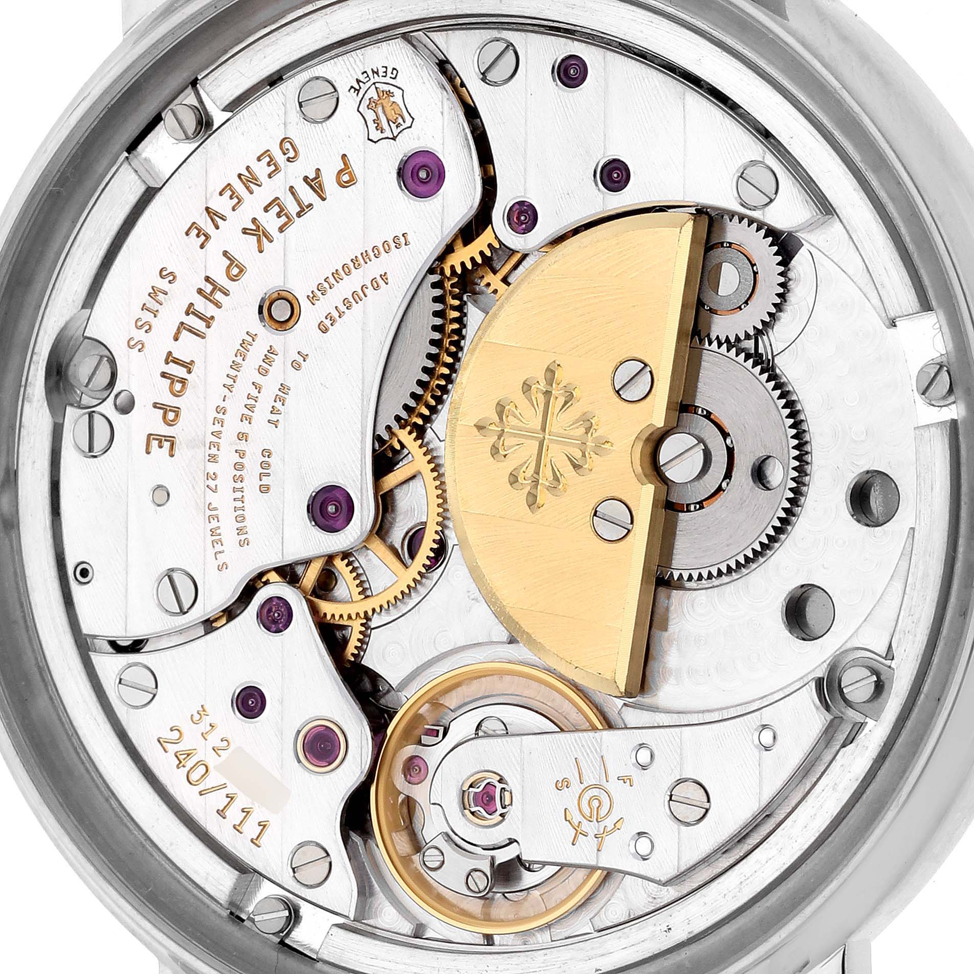 The image shows the back view of a Patek Philippe Calatrava 5120G Men's White Gold White Dial 5120G Men's White Gold White Dial movement, highlighting gears and the rotor.