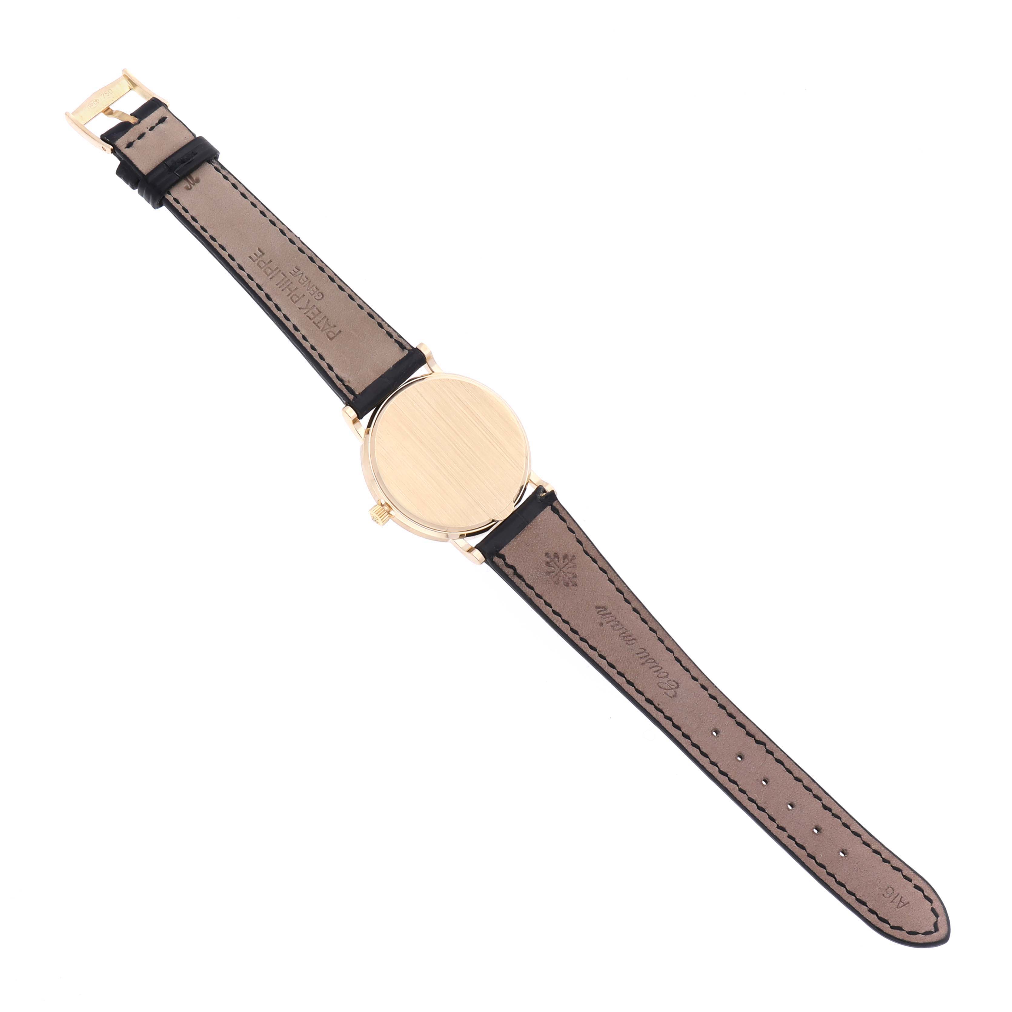 The image shows the back view of a Patek Philippe Calatrava 3802/200 Men's Yellow Gold White Dial 3802/200 Men's Yellow Gold White Dial watch, highlighting its case back and leather strap.