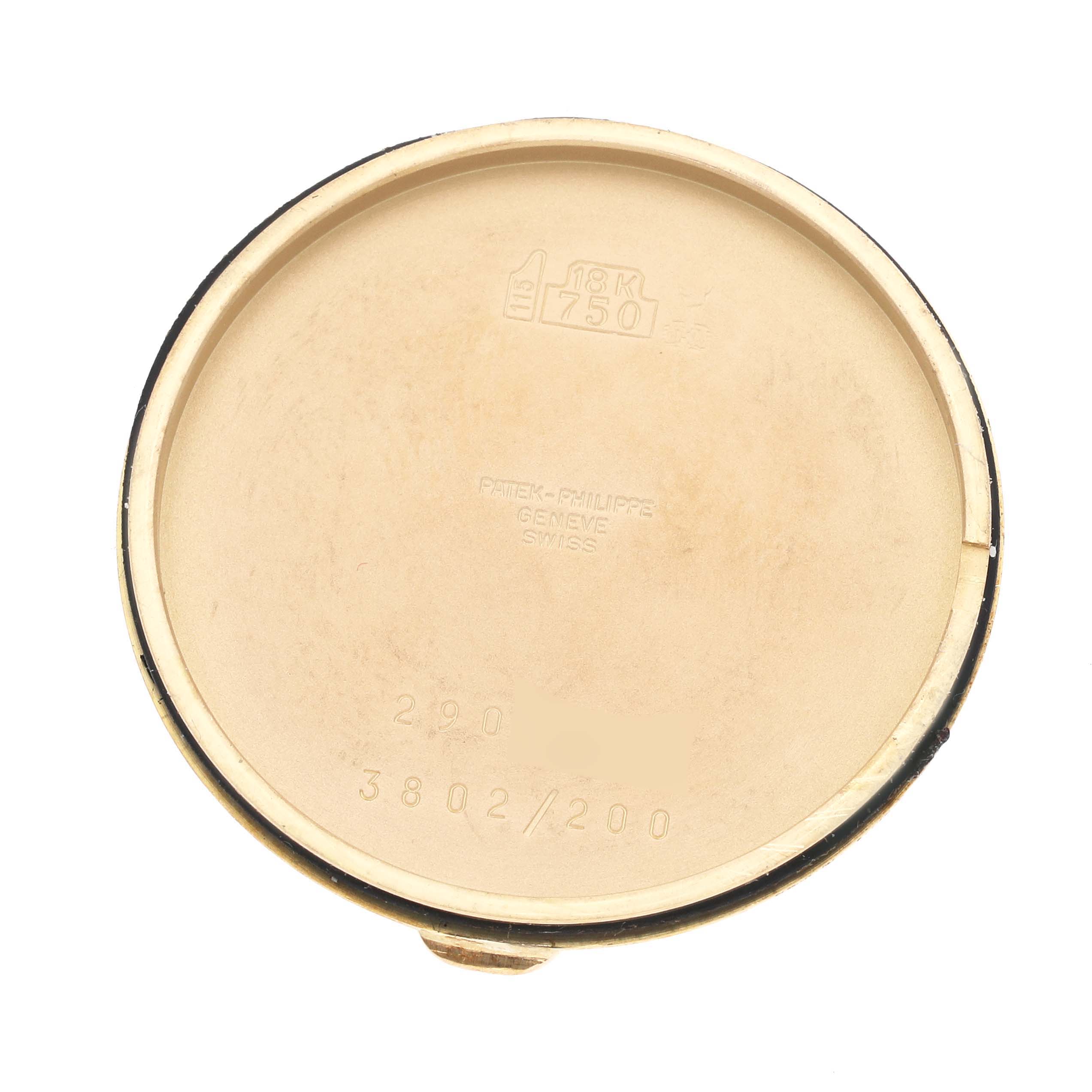 The image shows the inside of the case back of a Patek Philippe Calatrava 3802/200 Men's Yellow Gold White Dial 3802/200 Men's Yellow Gold White Dial watch, indicating it's 18K gold.