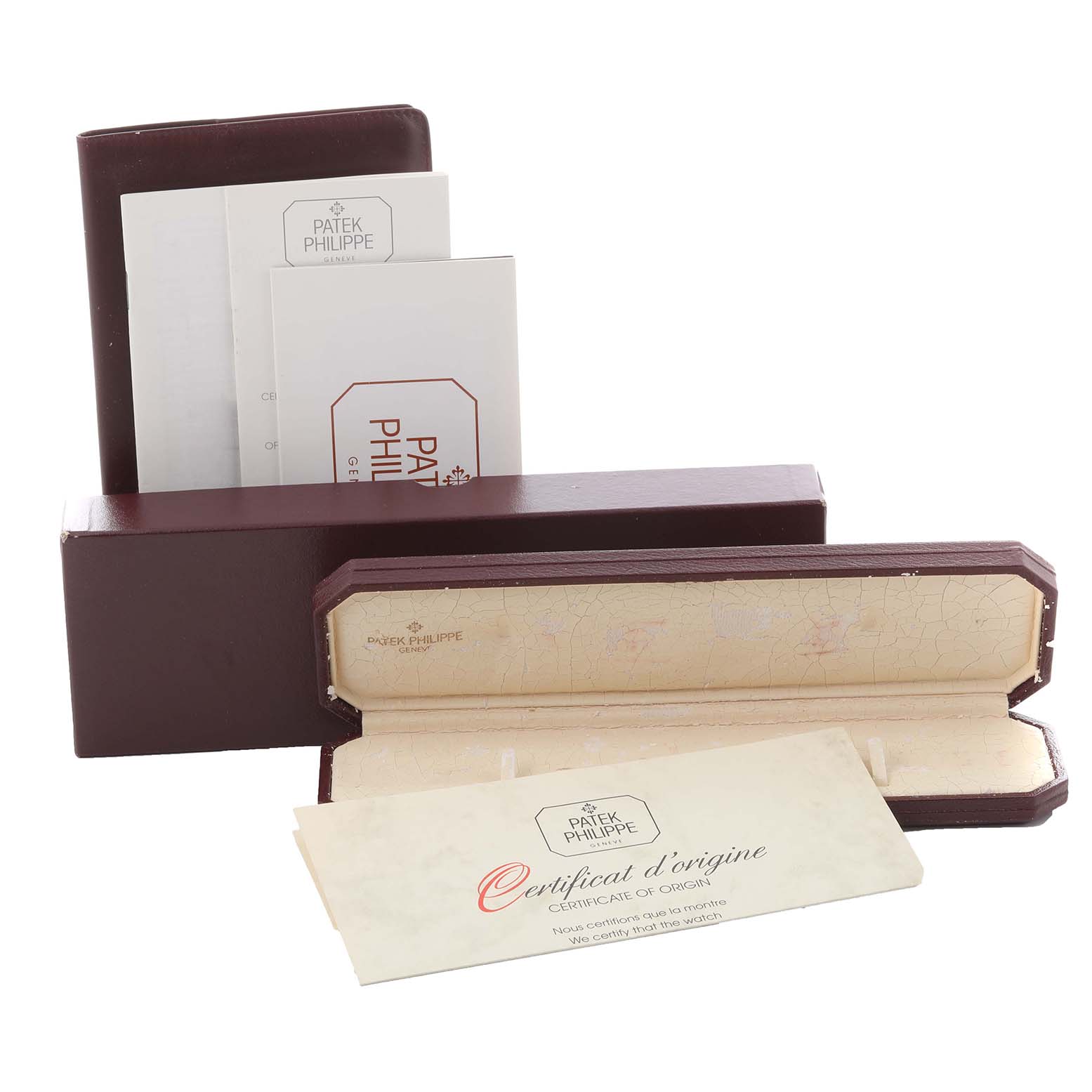 The image shows the packaging and certificates for a Patek Philippe Calatrava 3802/200 Men's Yellow Gold White Dial 3802/200 Men's Yellow Gold White Dial watch, including a box and paperwork.