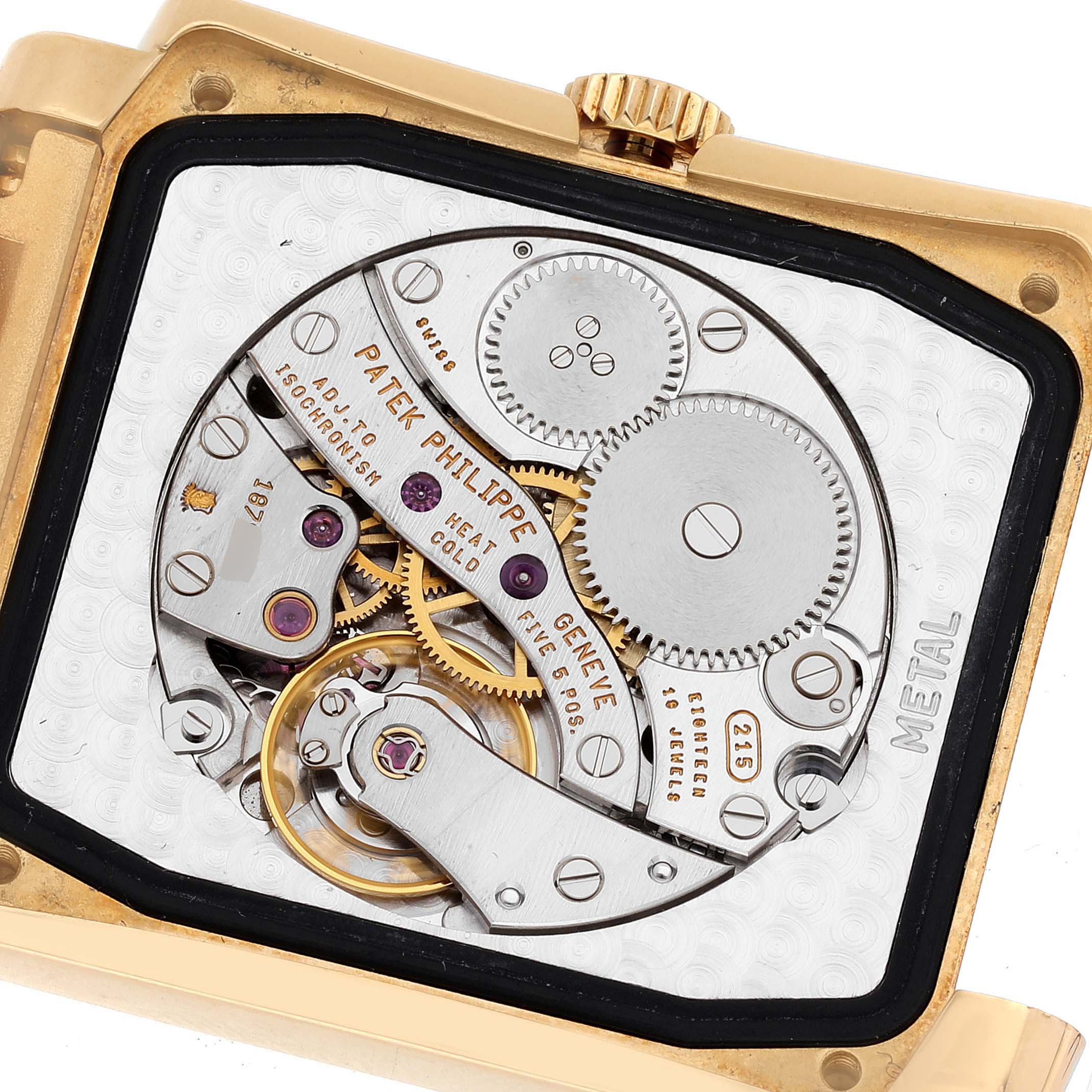 The image shows the back view of the Patek Philippe Gondolo 5024/1J-001 Men's Yellow Gold Silver Dial 5024/1J-001 Men's Yellow Gold Silver Dial watch, displaying its mechanical movement and internal components.