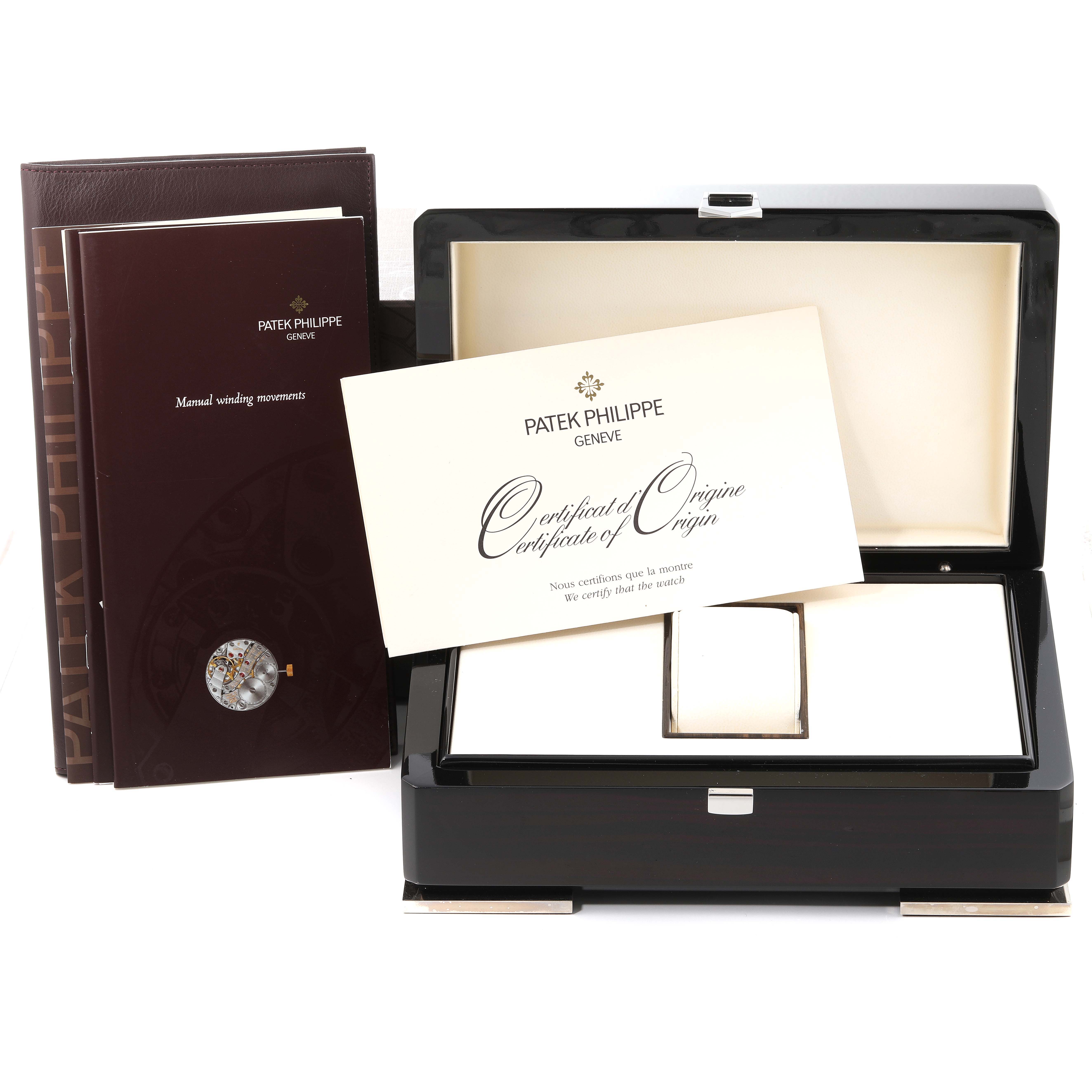 The image shows a Patek Philippe Gondolo 5024/1J-001 Men's Yellow Gold Silver Dial 5024/1J-001 Men's Yellow Gold Silver Dial watch box, manuals, and certificate of origin from a front angle.