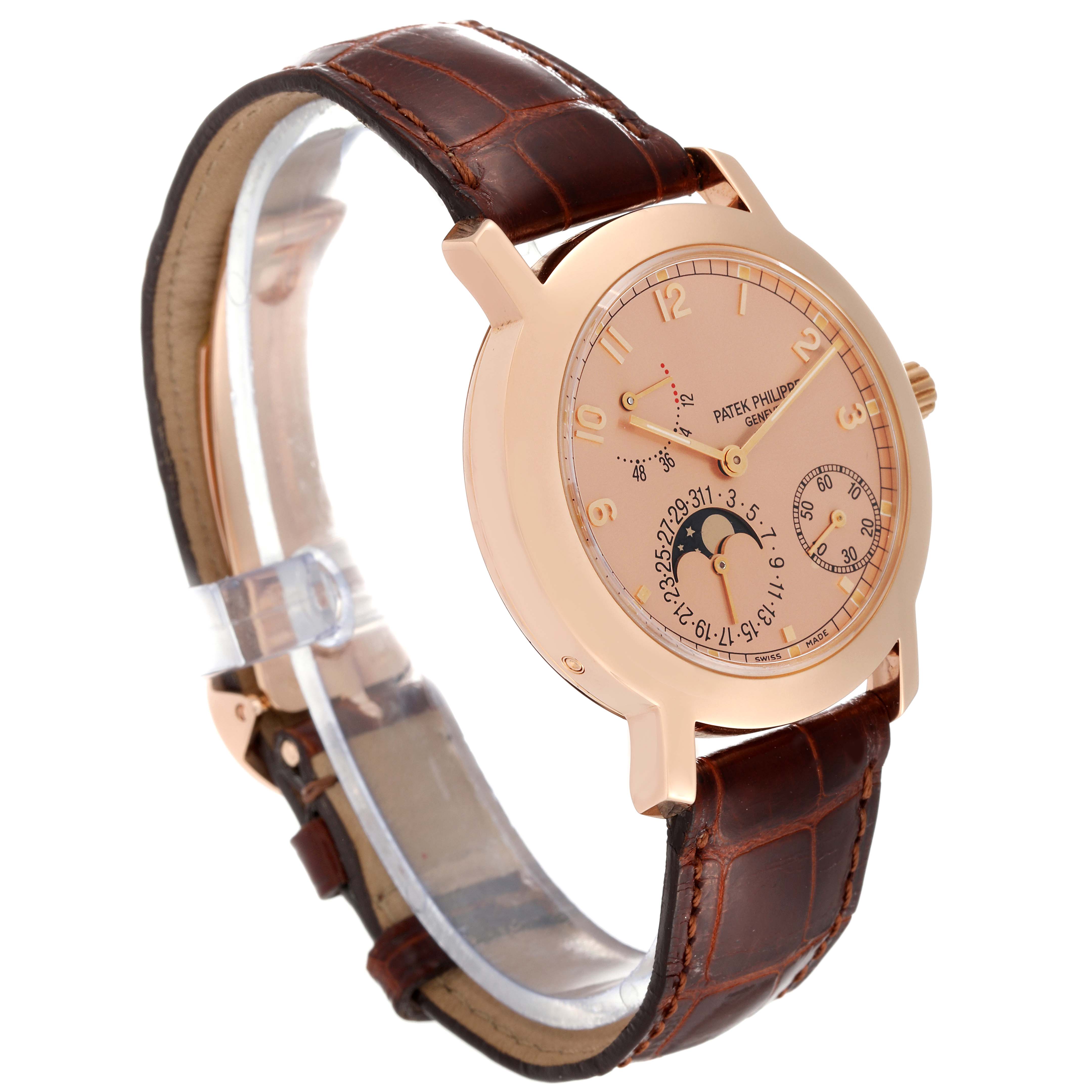 This Patek Philippe Complications 5055R-001 Men's Rose Gold Champagne Dial 5055R-001 Men's Rose Gold Champagne Dial model watch is shown at a three-quarter angle, highlighting the dial, case, and leather strap.