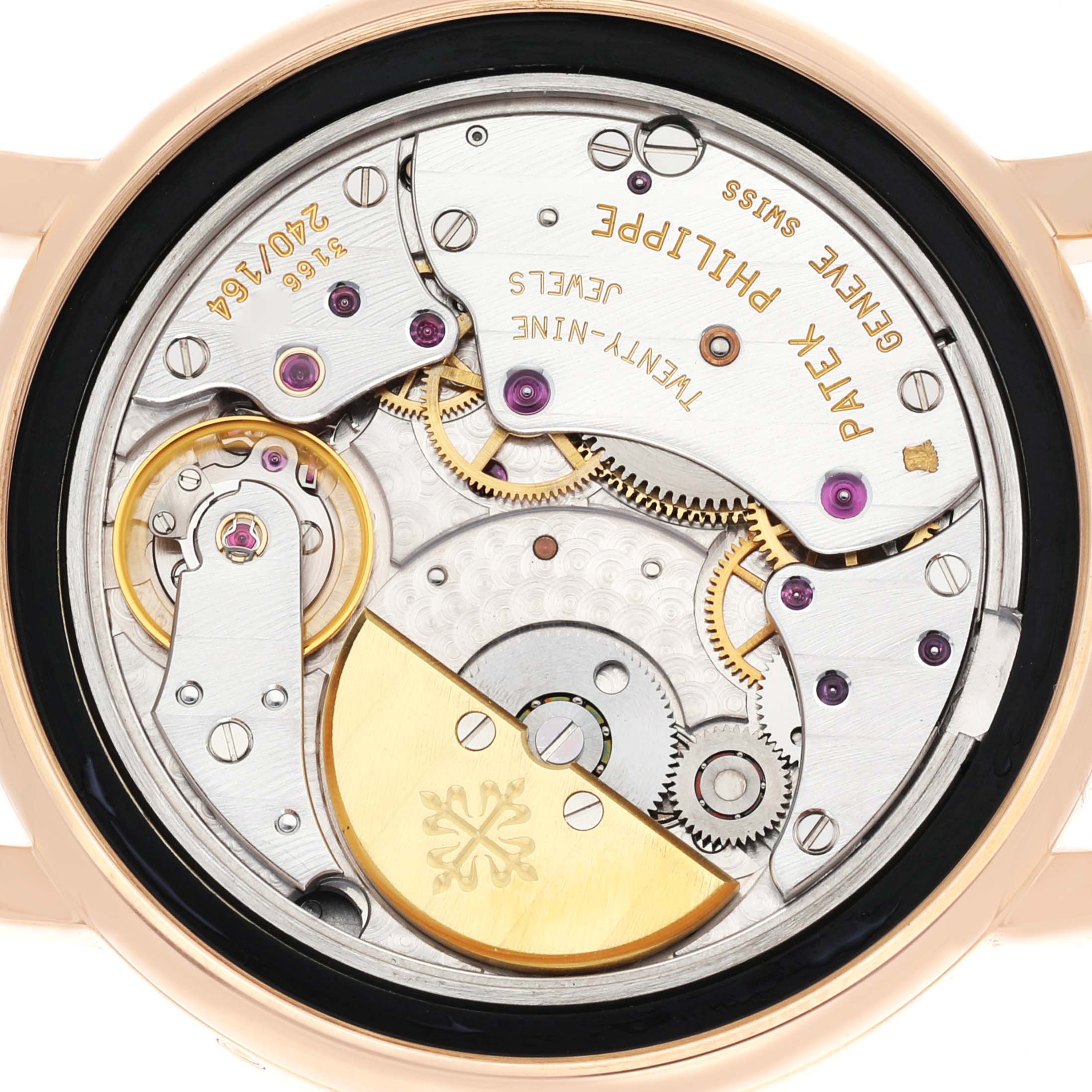 The image shows the back view of a Patek Philippe Complications 5055R-001 Men's Rose Gold Champagne Dial 5055R-001 Men's Rose Gold Champagne Dial watch, highlighting its intricate mechanical movement.