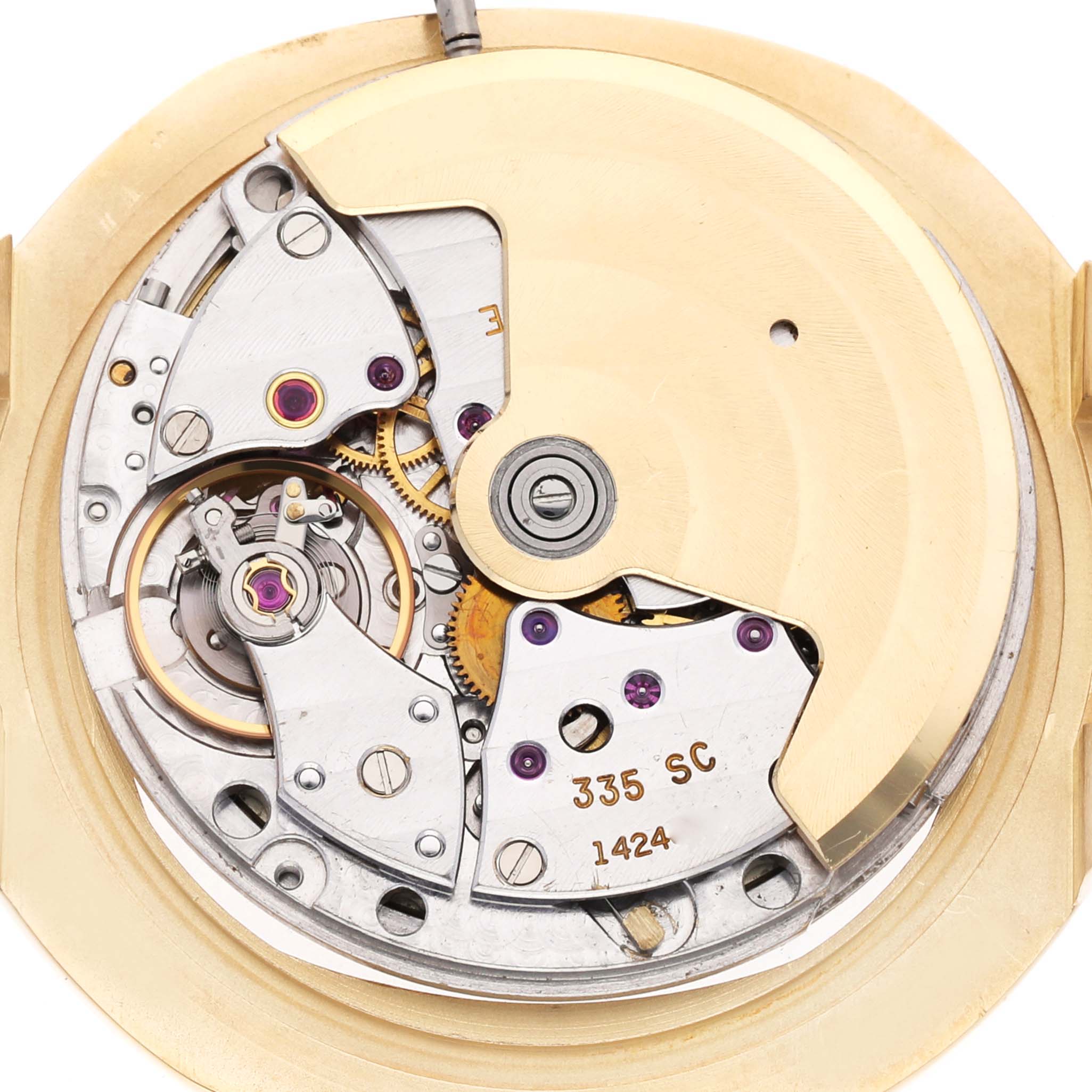 This image shows the intricate movement mechanism of the Patek Philippe Nautilus 3800/1J Men's Yellow Gold Champagne Dial 3800/1J Men's Yellow Gold Champagne Dial watch, viewed from the back.