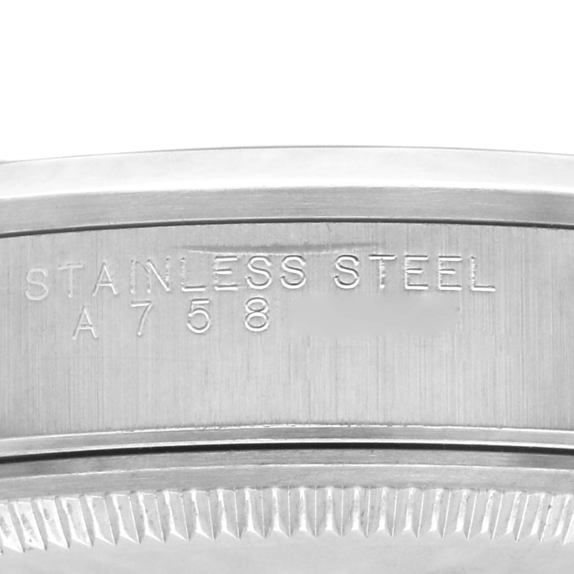 The image shows the engraved side of a stainless steel Rolex Air-King 14000 Men's Stainless Steel White Dial 14000 Men's Stainless Steel White Dial watch case.