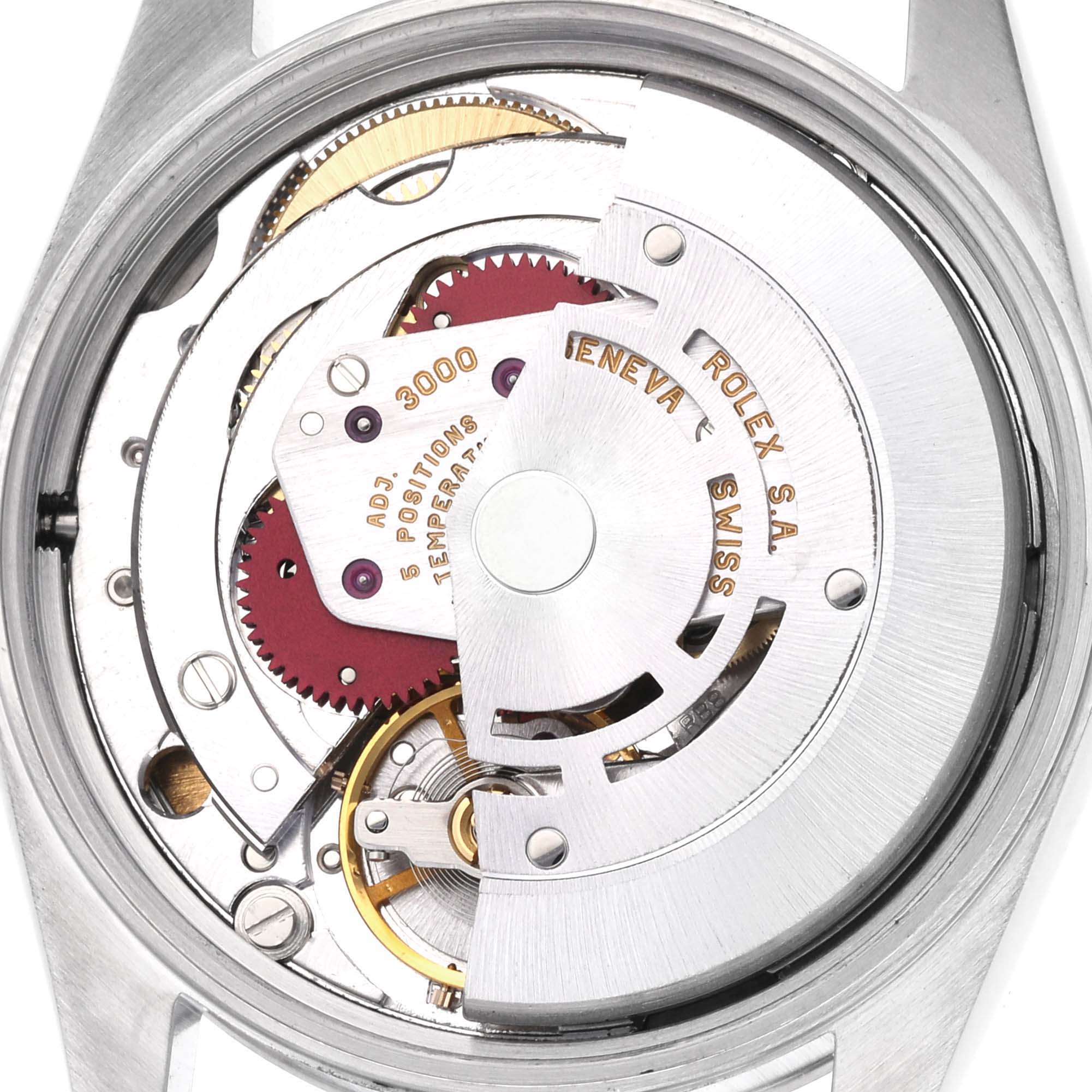 The image shows the internal movement mechanism of a Rolex Air-King 14000 Men's Stainless Steel White Dial 14000 Men's Stainless Steel White Dial watch from a back view, highlighting gears and components.