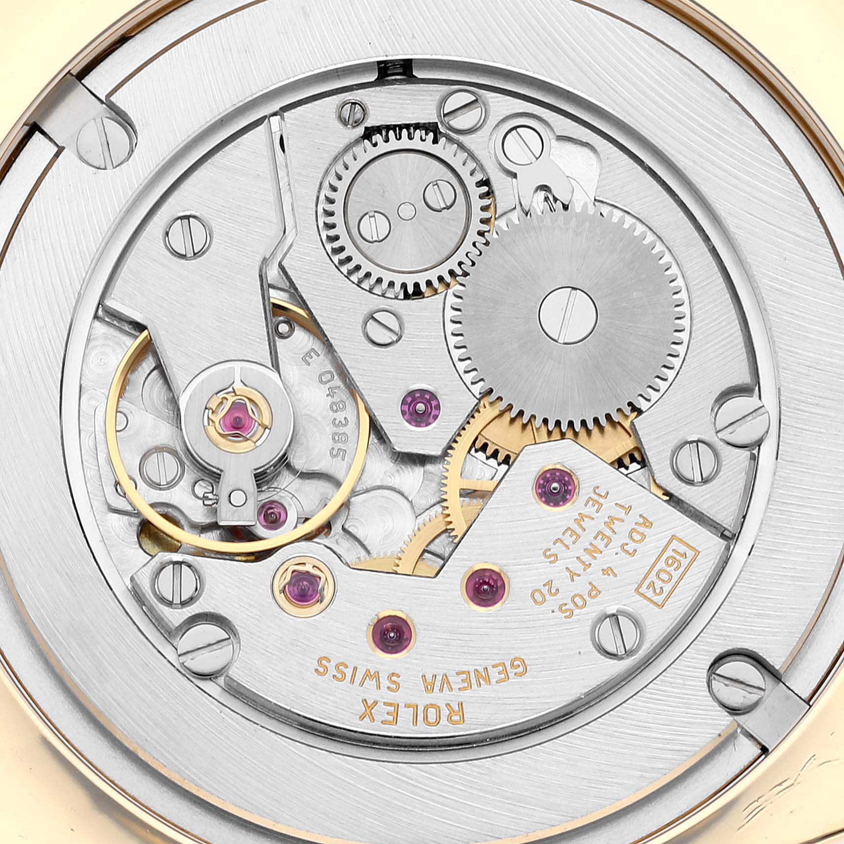 The image shows a close-up of the movement mechanism of a Rolex Cellini 4233/8 Men's Yellow Gold Black Dial 4233/8 Men's Yellow Gold Black Dial watch, displaying gears, screws, and jewels.