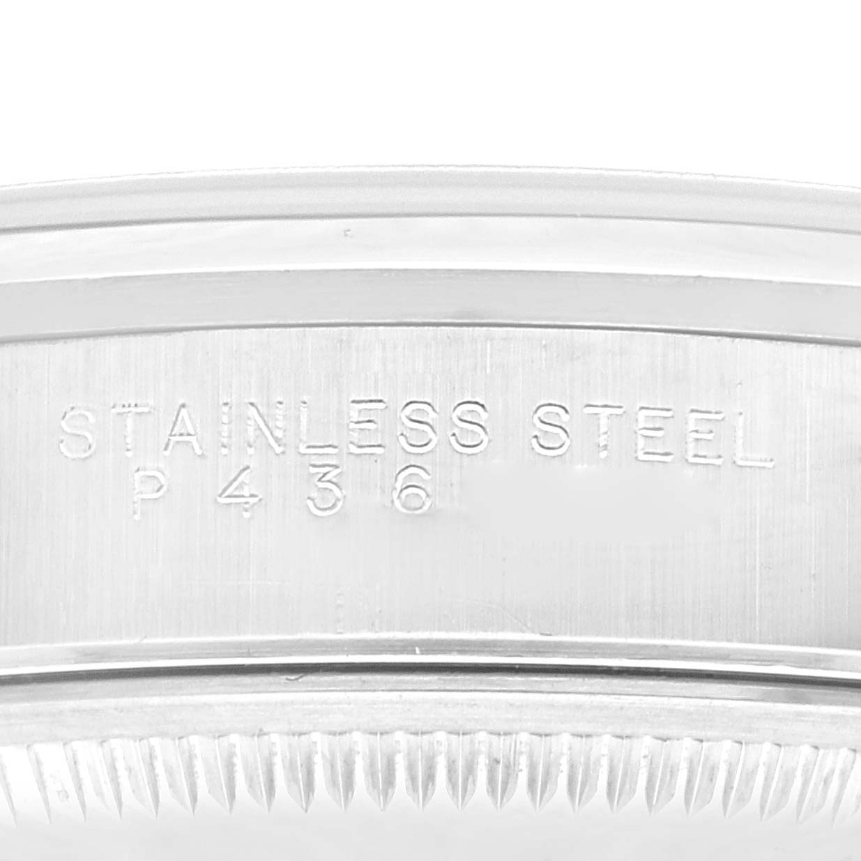 This image shows a close-up of the stainless steel casing with serial number engraving on a Rolex Date 15200 Men's Stainless Steel Blue Dial 15200 Men's Stainless Steel Blue Dial watch.