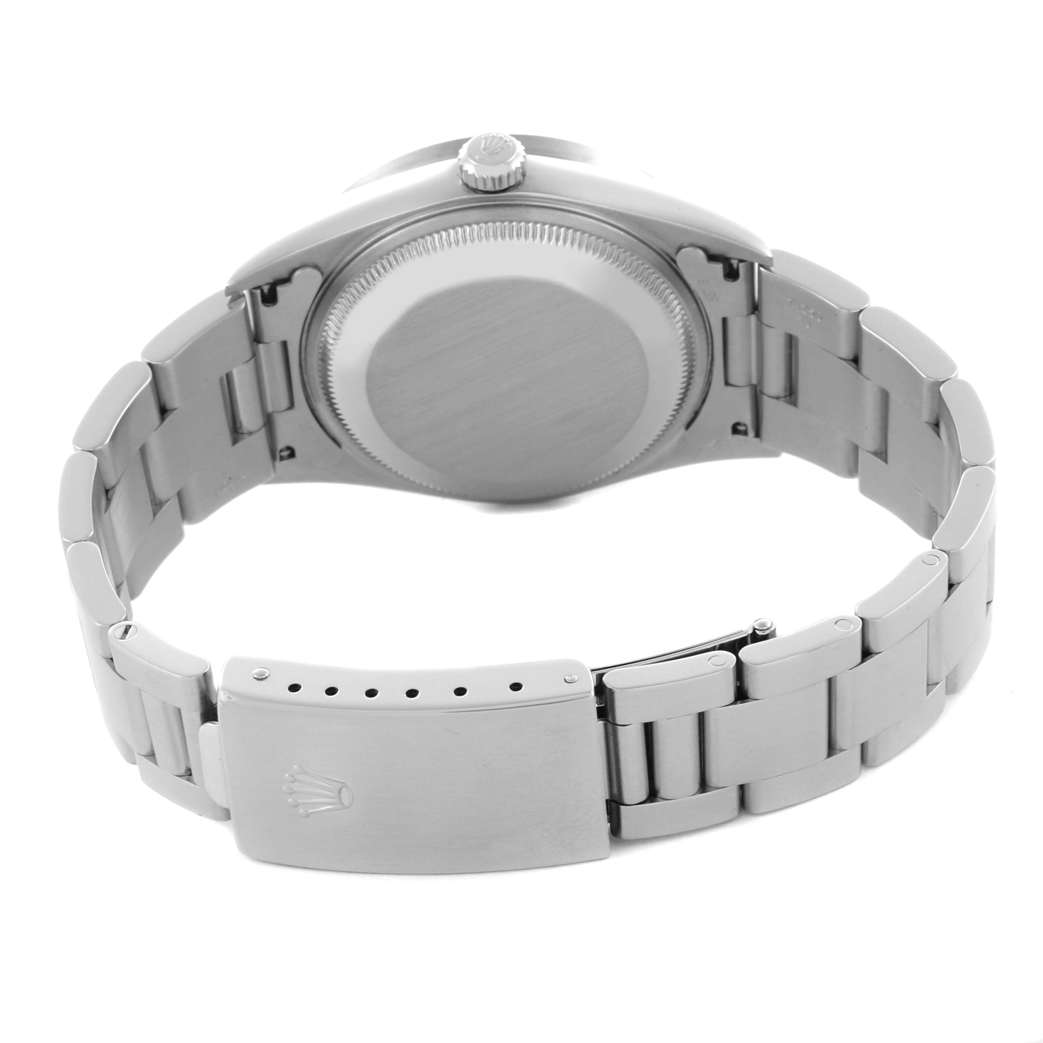 The image shows the back view of a Rolex Date 15210 Men's Stainless Steel Silver Dial 15210 Men's Stainless Steel Silver Dial model, featuring its case back, bracelet, and clasp.