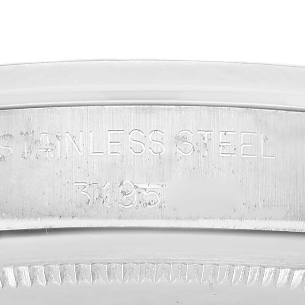 The image shows a close-up of the engraved stainless steel casing of the Rolex Vintage Collection 1500 Men's Stainless Steel Silver Dial 1500 Men's Stainless Steel Silver Dial watch, highlighting the serial number.