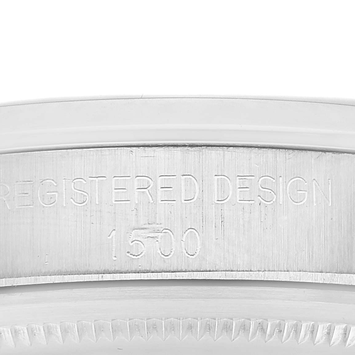 This image shows a close-up of the side engraving on the bezel of a Vintage Collection Rolex watch.