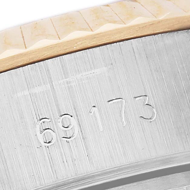 The image shows a close-up of the side bezel and case with the model number of the Rolex Date 69173 Women
s Steel and Gold (two tone) White Dial 69173 Women
s Steel and Gold (two tone) White Dial watch.