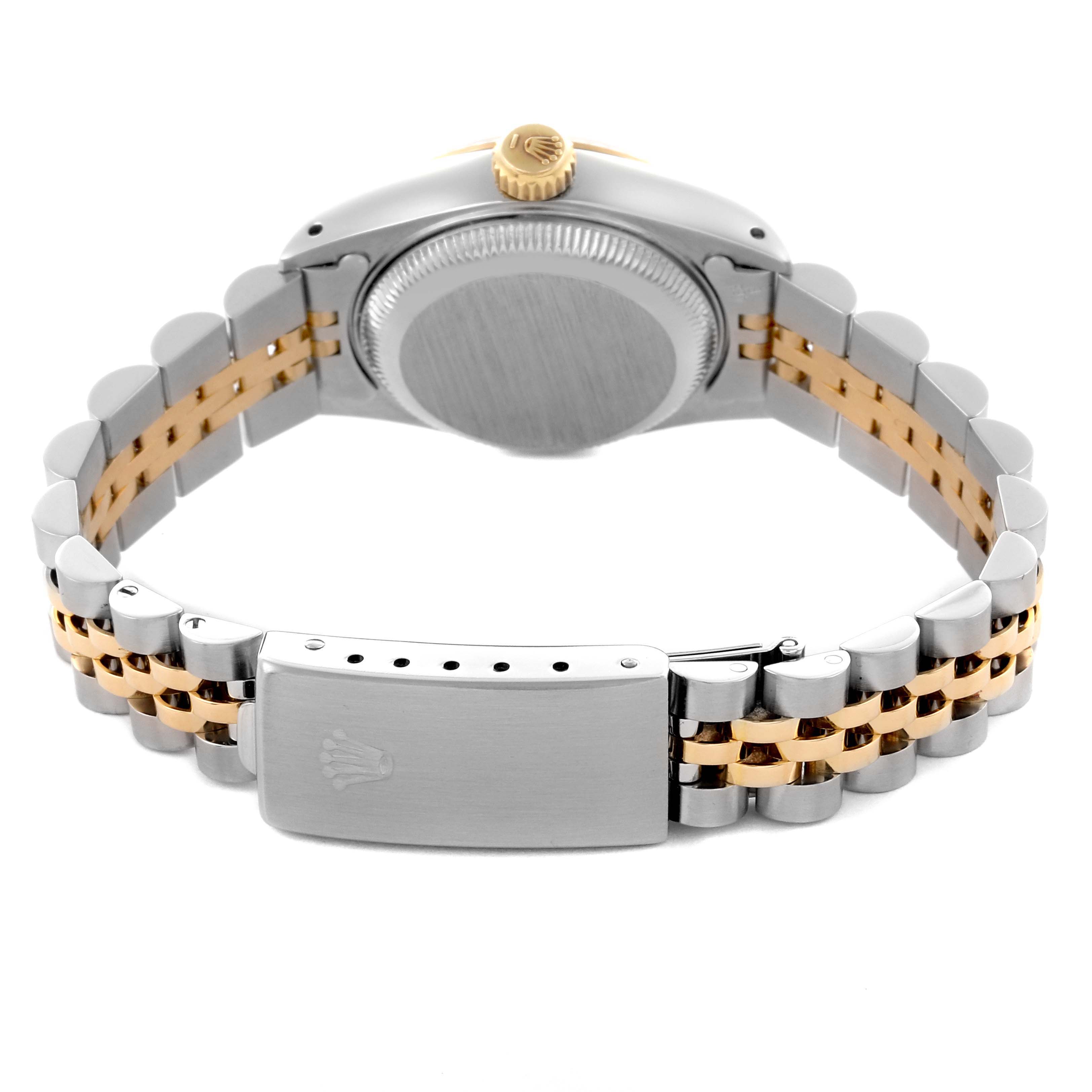 The image shows the back case, crown, and clasp of a Rolex Date 69173 Women
s Steel and Gold (two tone) White Dial 69173 Women
s Steel and Gold (two tone) White Dial watch with a two-tone bracelet, viewed from the rear.