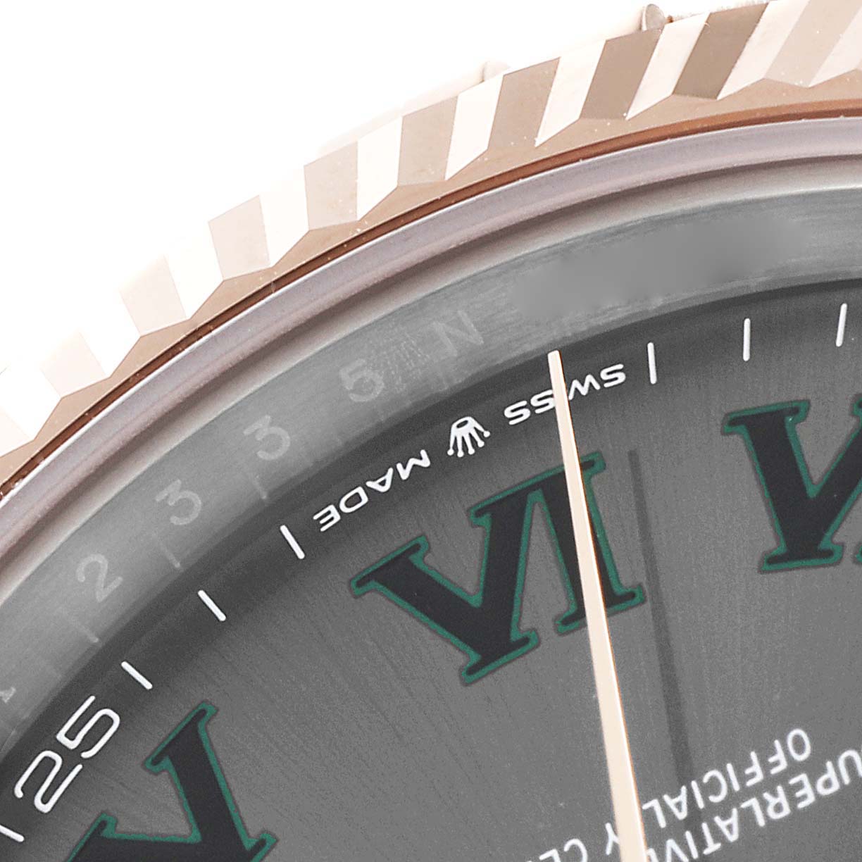 The image shows a close-up angle of the Rolex Datejust 41 126331 Men's Steel and Gold (two tone) Grey Dial 126331 Men's Steel and Gold (two tone) Grey Dial model, featuring the bezel, part of the dial, and the "SWISS MADE" text.