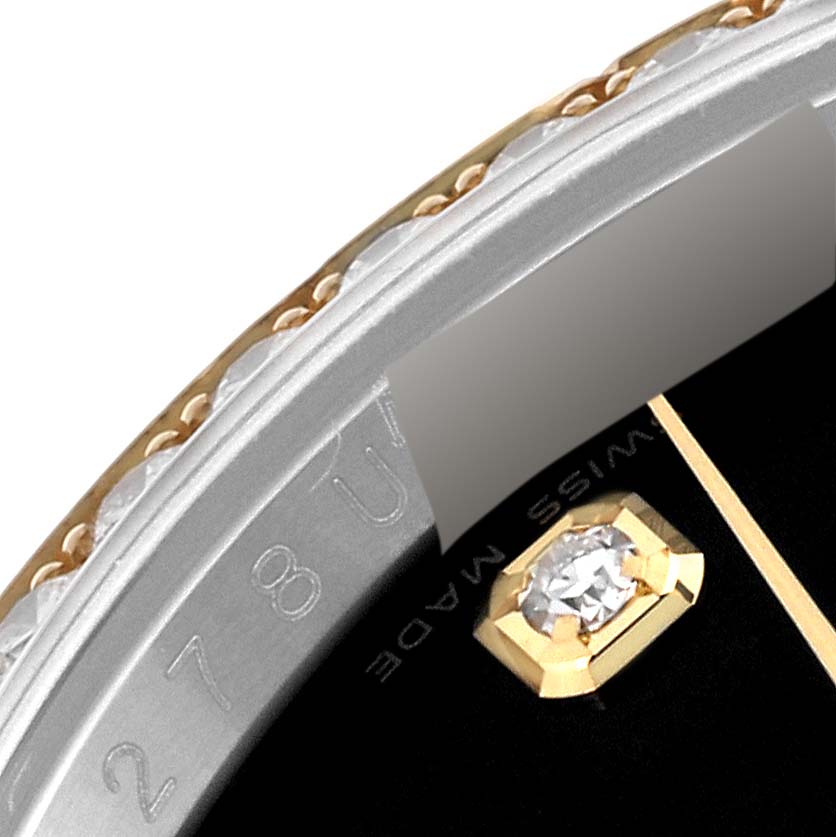 This close-up image of the Rolex Datejust 116243 Men's Steel and Gold (two tone) Black Dial 116243 Men's Steel and Gold (two tone) Black Dial watch shows part of the bezel, dial, and hour marker details.