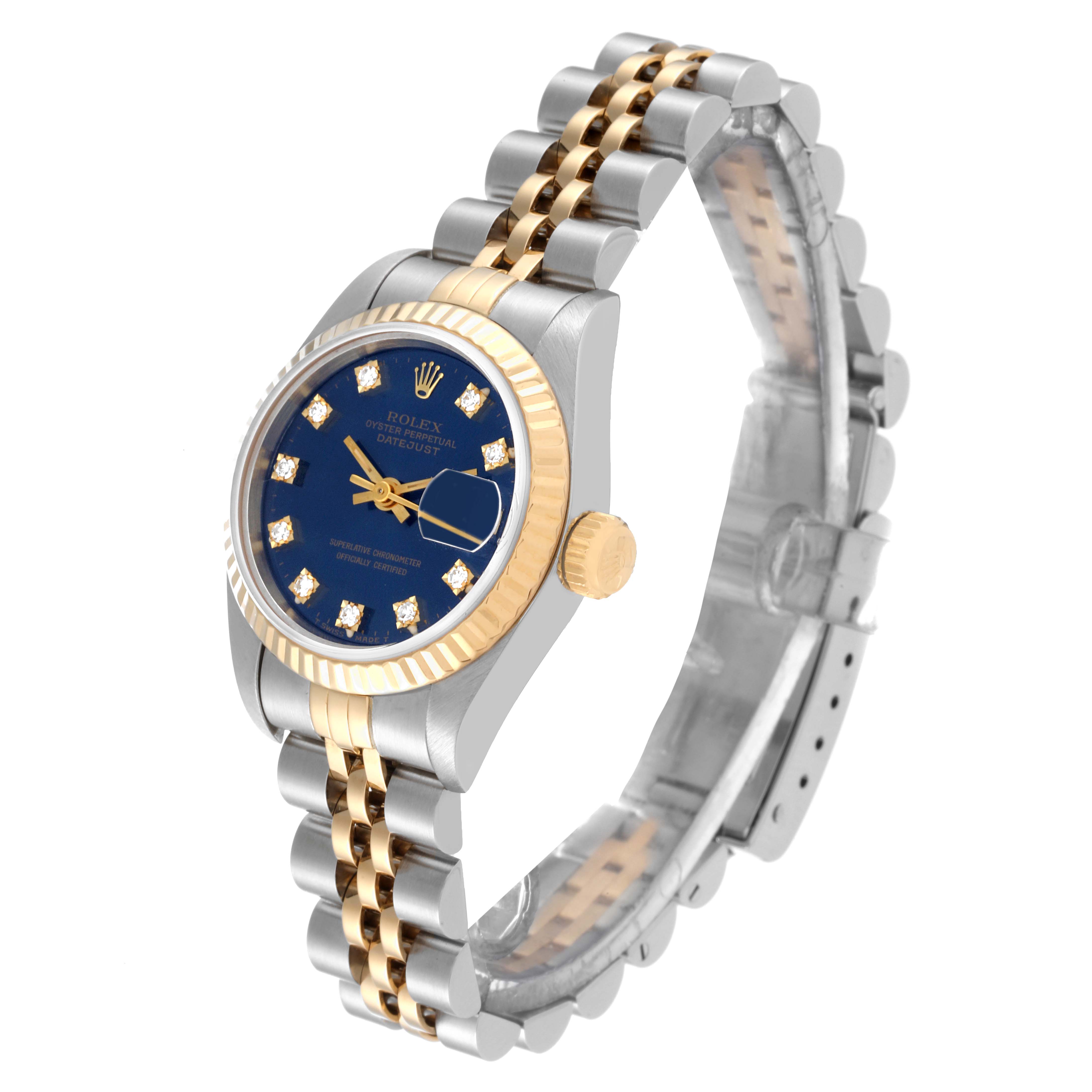 The image shows an angled view of a Rolex Datejust 69173 Women's Steel and Gold (two tone) Blue Dial 69173 Women's Steel and Gold (two tone) Blue Dial watch, highlighting the blue dial, fluted bezel, crown, and two-tone jubilee bracelet.