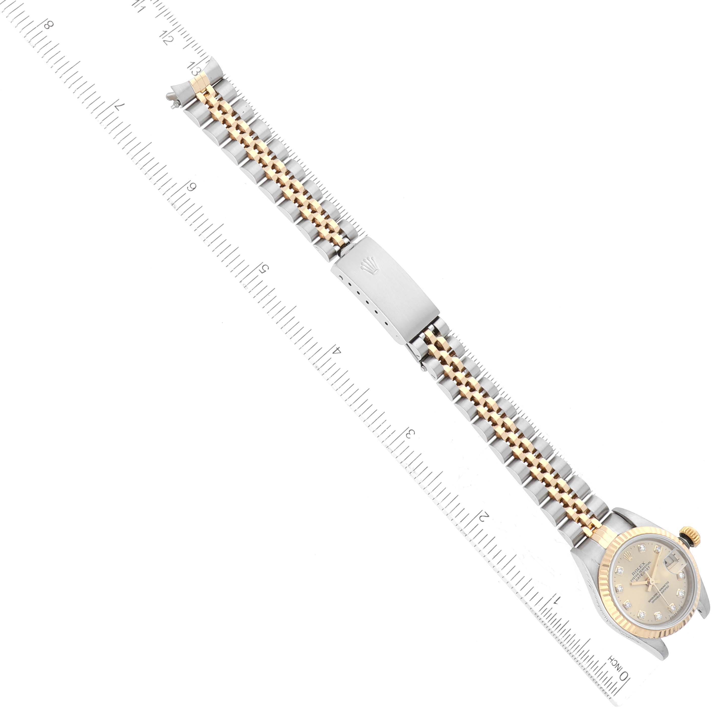 The image shows a Rolex Datejust 69173 Women's Steel and Gold (two tone) Champagne Dial 69173 Women's Steel and Gold (two tone) Champagne Dial watch laid flat with its face, bracelet, and clasp visible alongside a ruler for measurement.