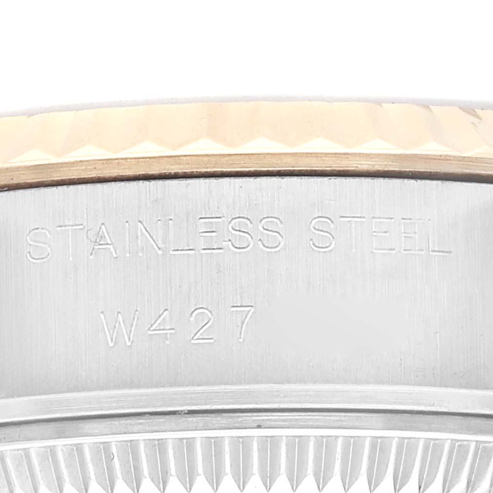 The image shows a close-up angle of the stainless steel case side, bezel, and part of the fluted bezel edge of a Rolex Datejust 69173G Women's Steel and Gold (two tone) Champagne Dial 69173G Women's Steel and Gold (two tone) Champagne Dial watch.