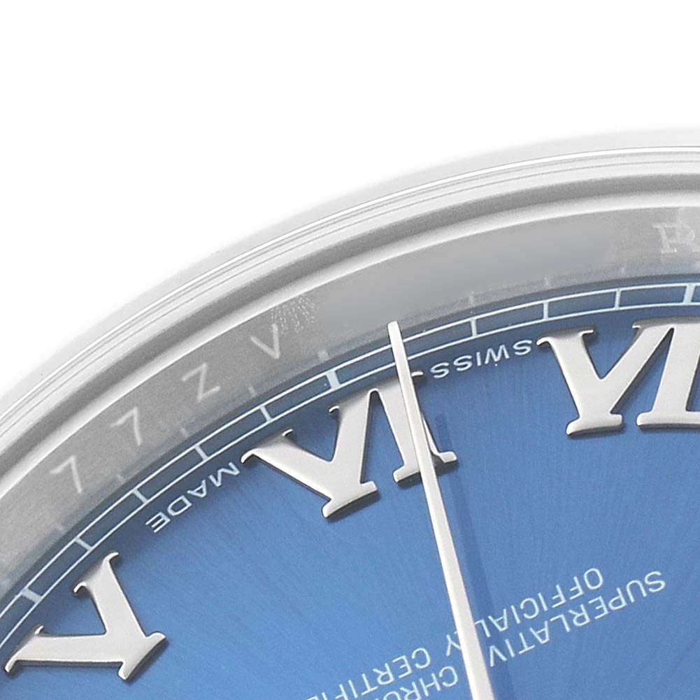 The image shows a close-up of the blue dial of a Rolex Datejust 41 116300 Men's Stainless Steel Blue Dial watch with Roman numerals and part of the minute hand.