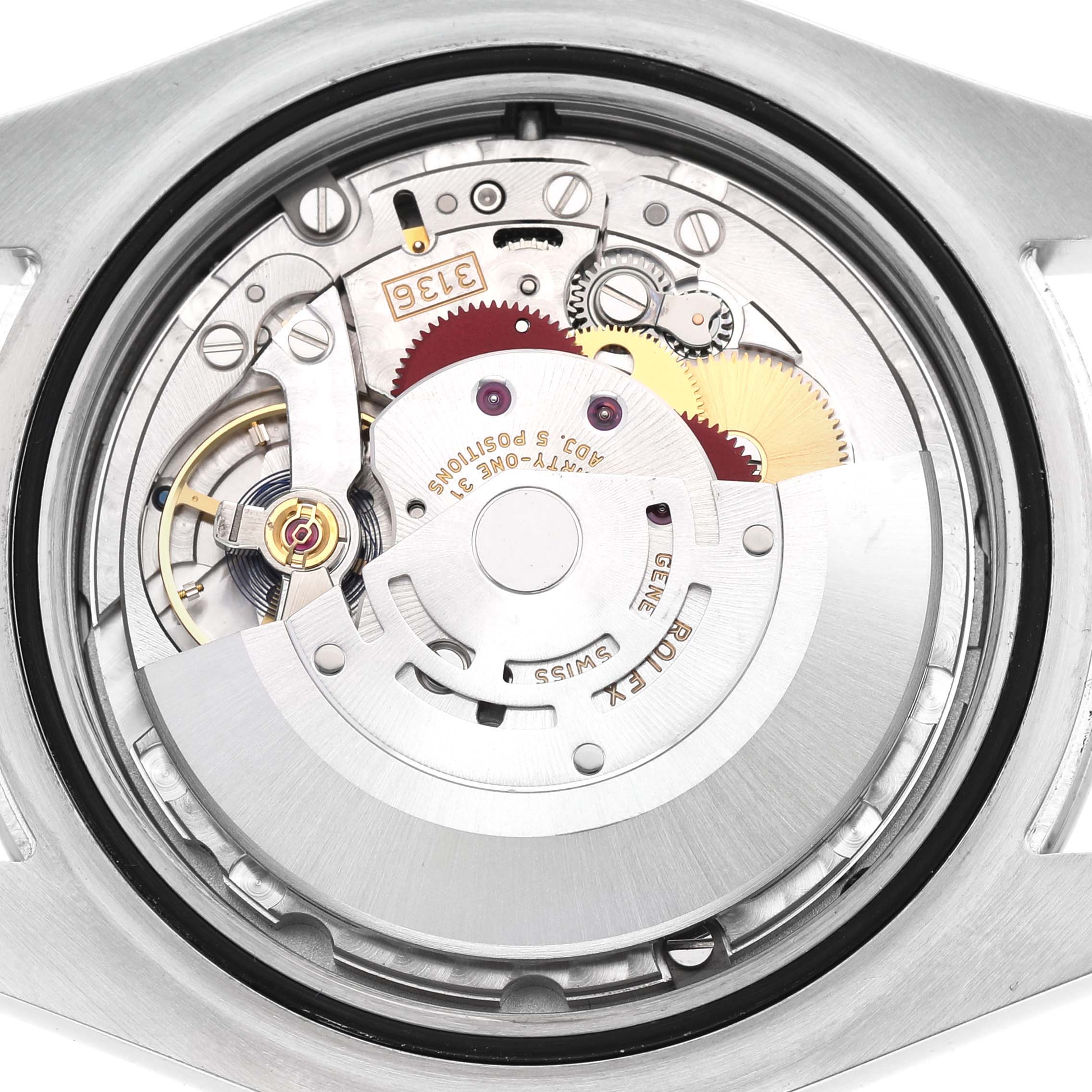 The image shows the movement inside a Rolex Datejust 41 116300 Men's Stainless Steel Blue Dial, highlighting its gears and components from a rear angle.