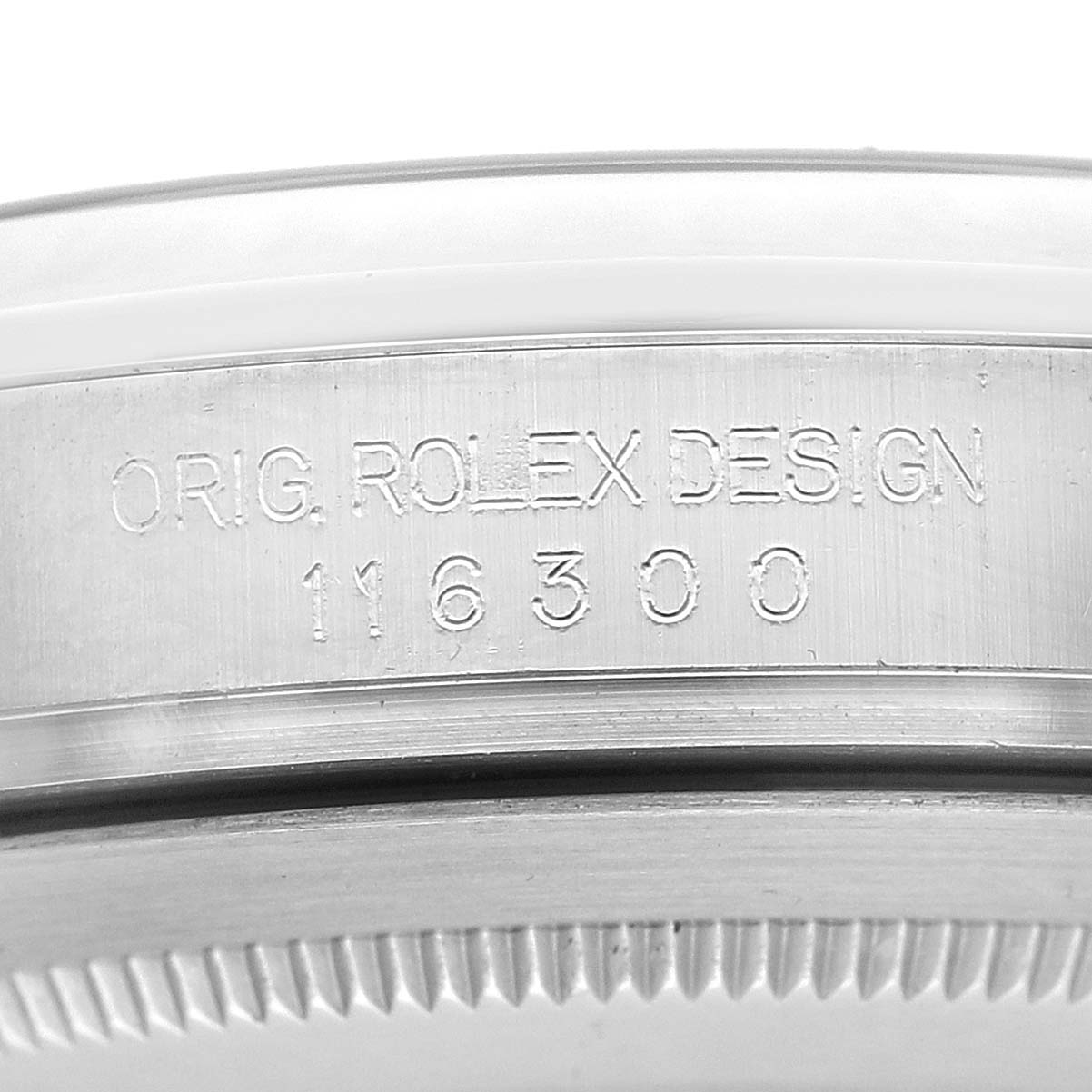 The image shows a close-up of the case side, bezel, and engraved details of a Rolex Datejust 41 116300 Men's Stainless Steel Blue Dial.